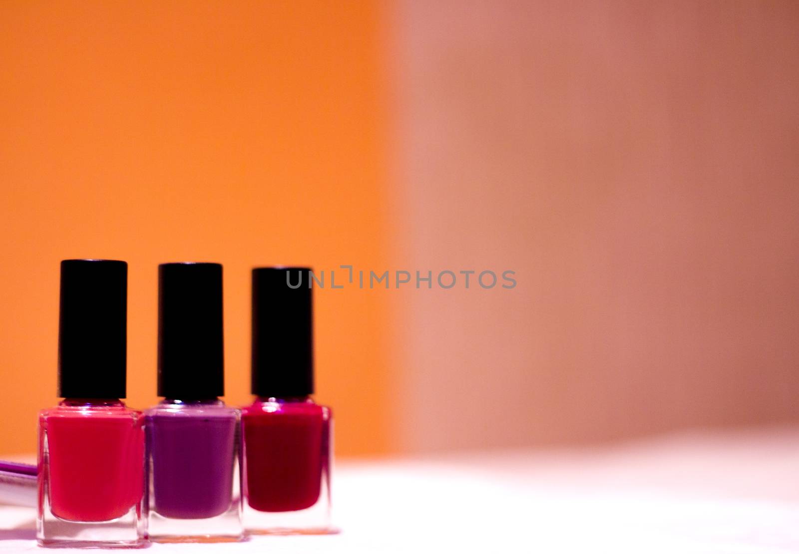 Nail polishes with strong colors. No people. Copy space