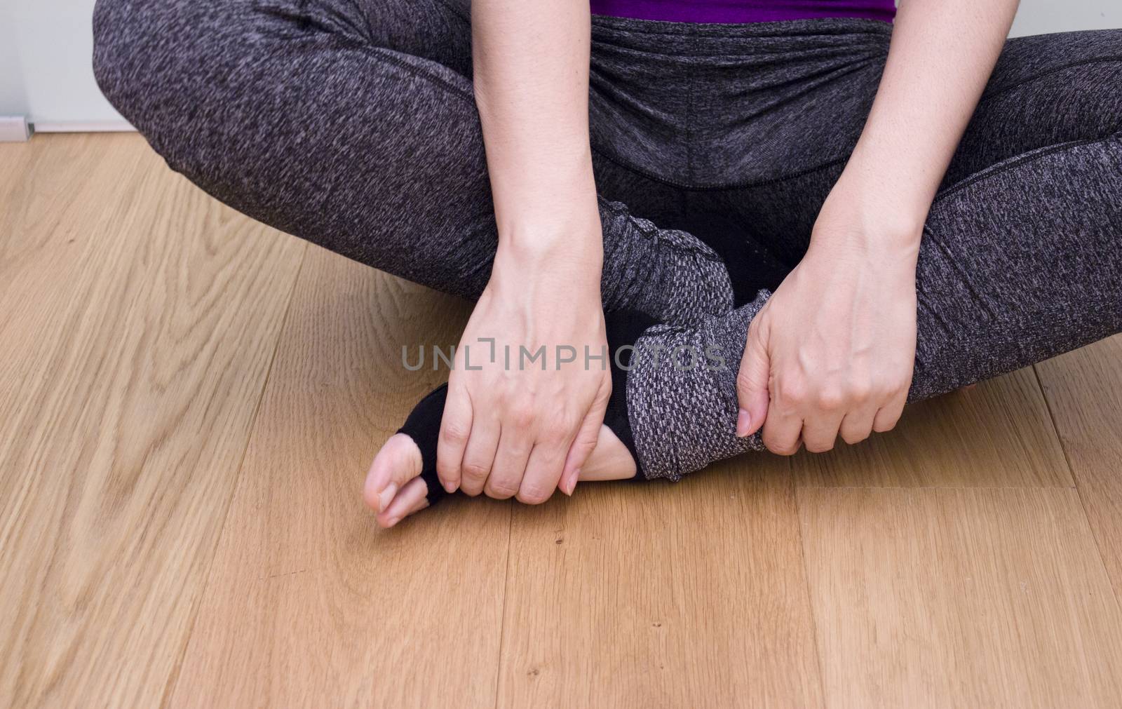 Womans hands practicing yoga and meditation positions by GemaIbarra