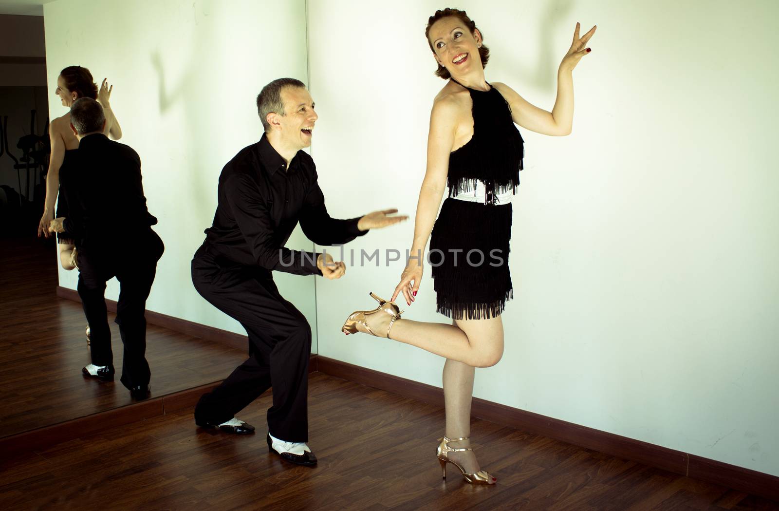 Couple of dancers dancing latin dances by GemaIbarra