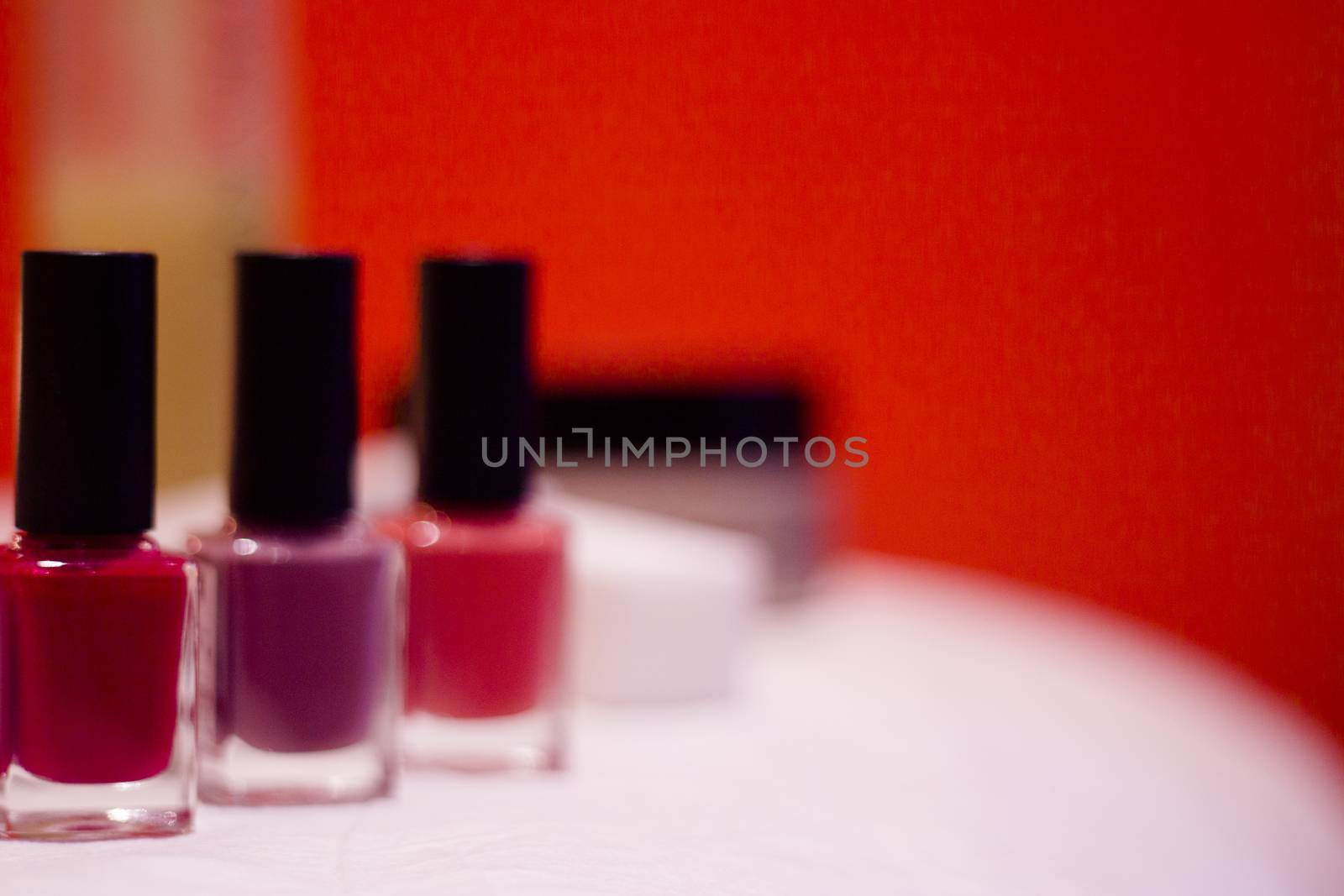Nail polishes with strong colors. No people. Copy space