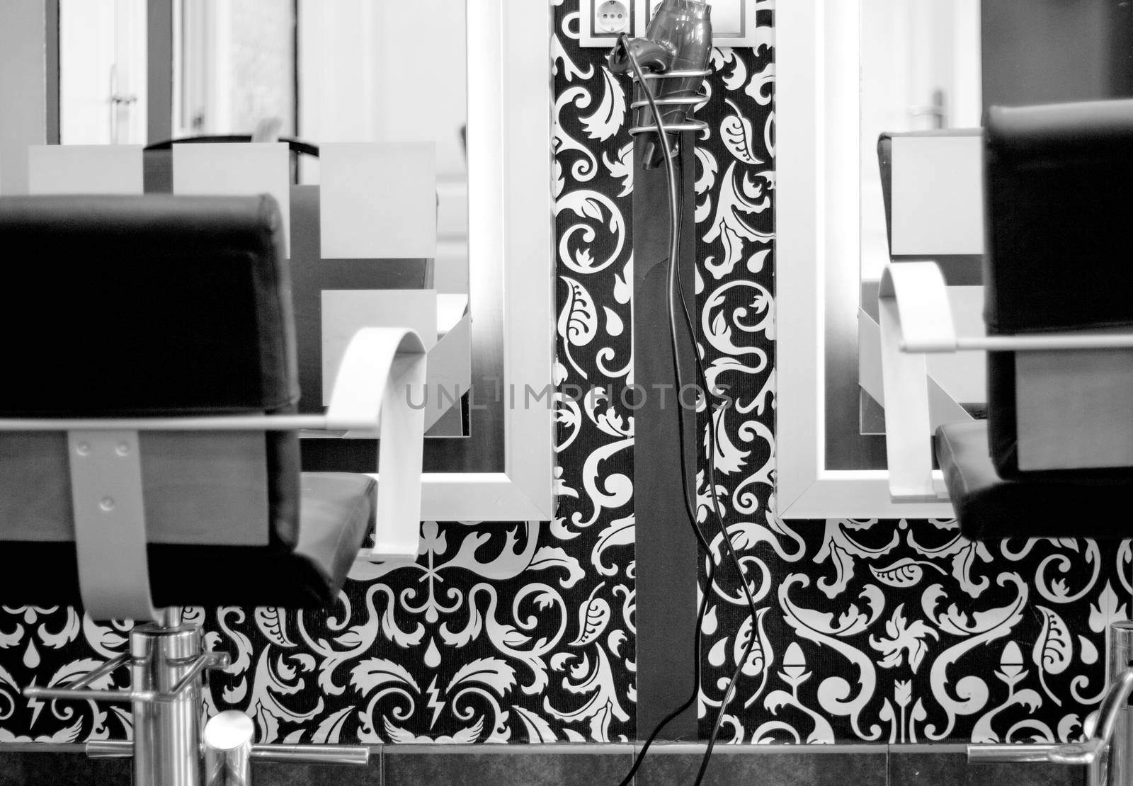 Part of a beauty salon with chairs for clients