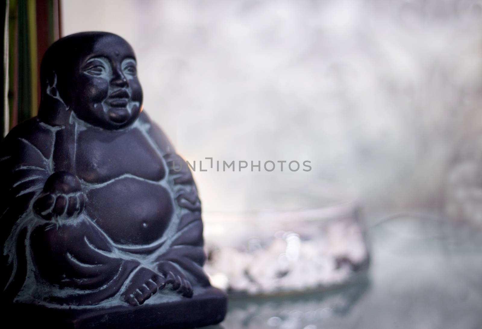 Generic buddha decoration with candle and flower. Relax scene