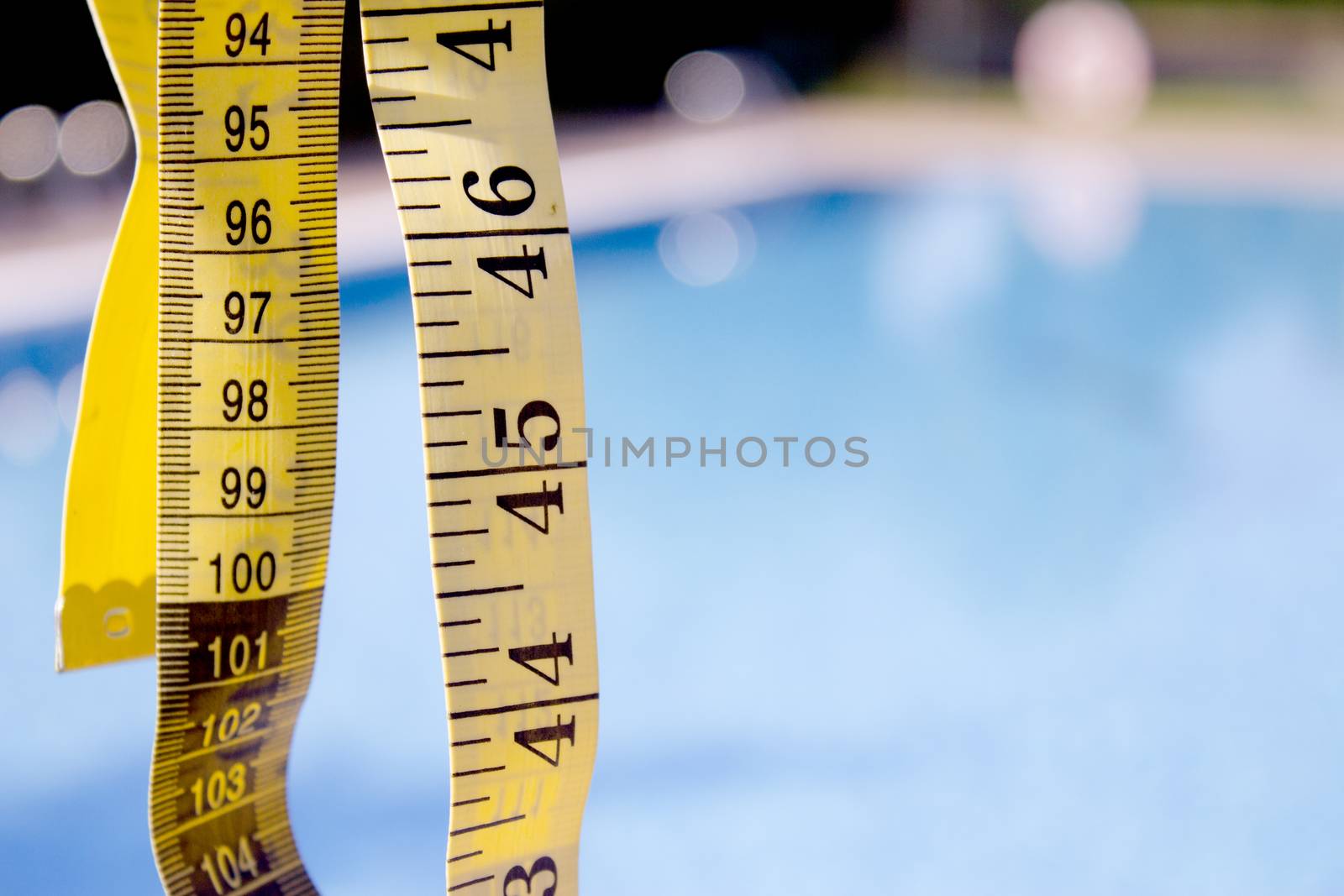 Measuring tape on pool background. No people