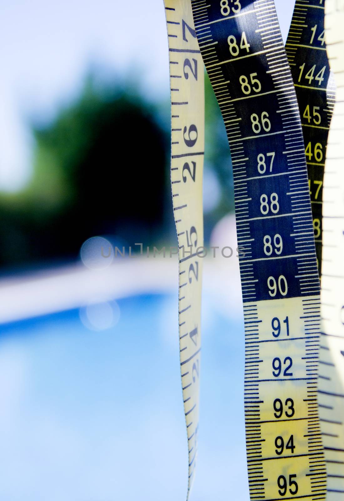 Measuring tape on pool background. No people