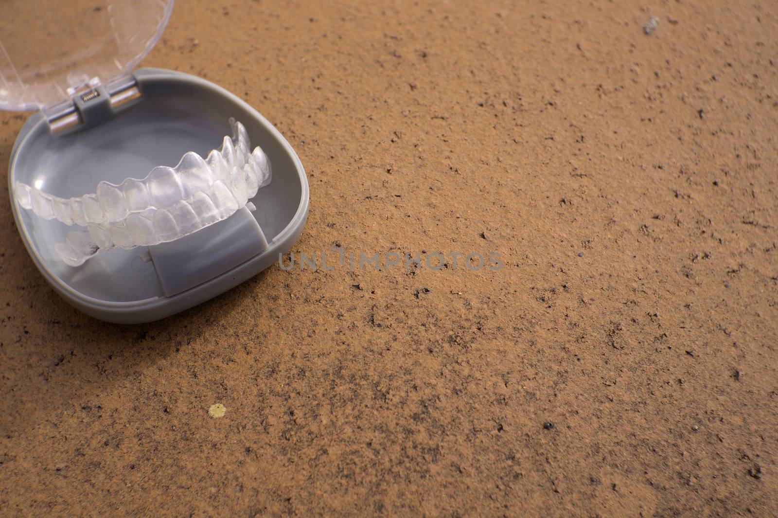 Transparent dental orthodontics in a protective box. No people