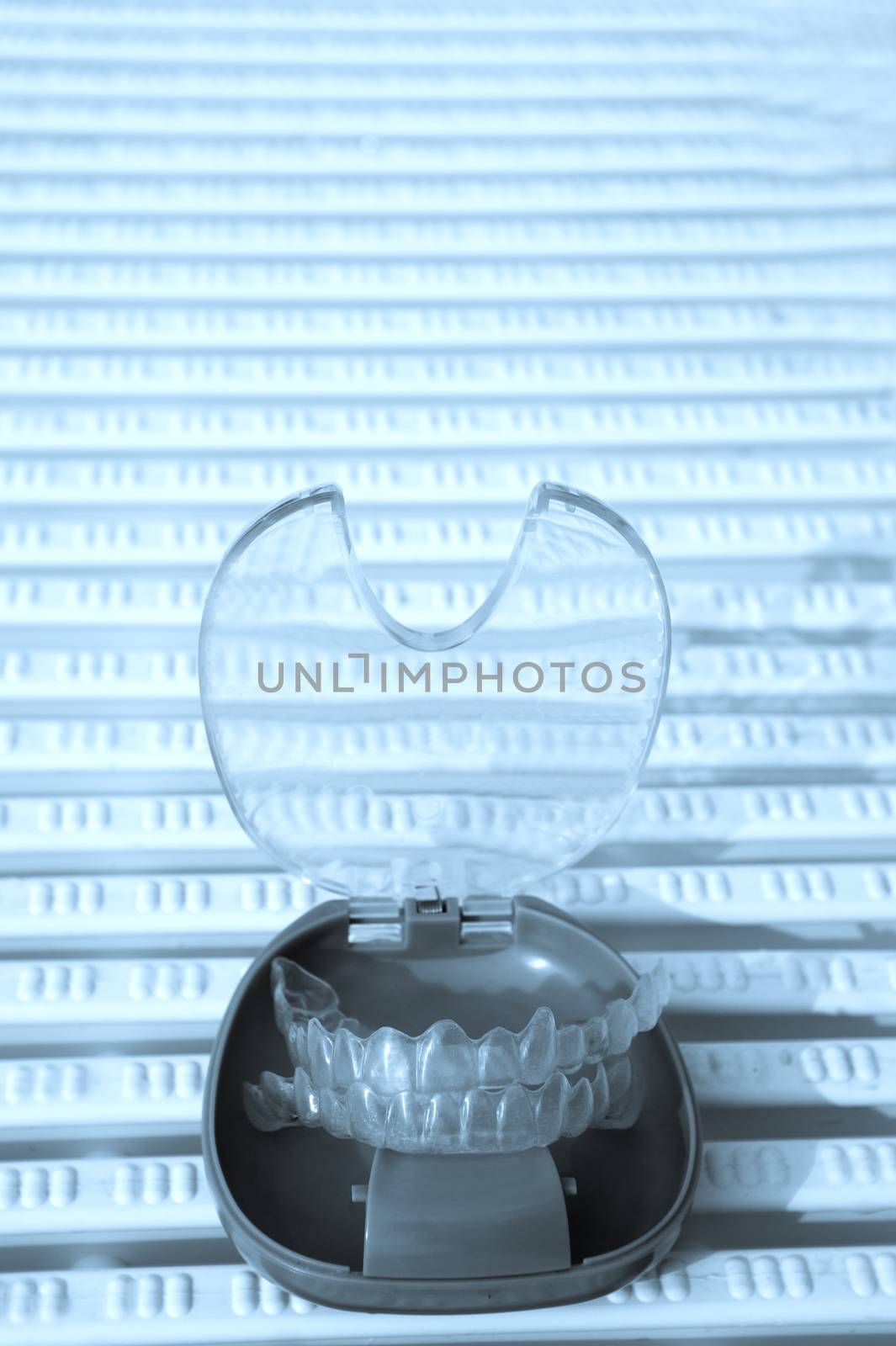 Transparent dental orthodontics in a protective box. No people