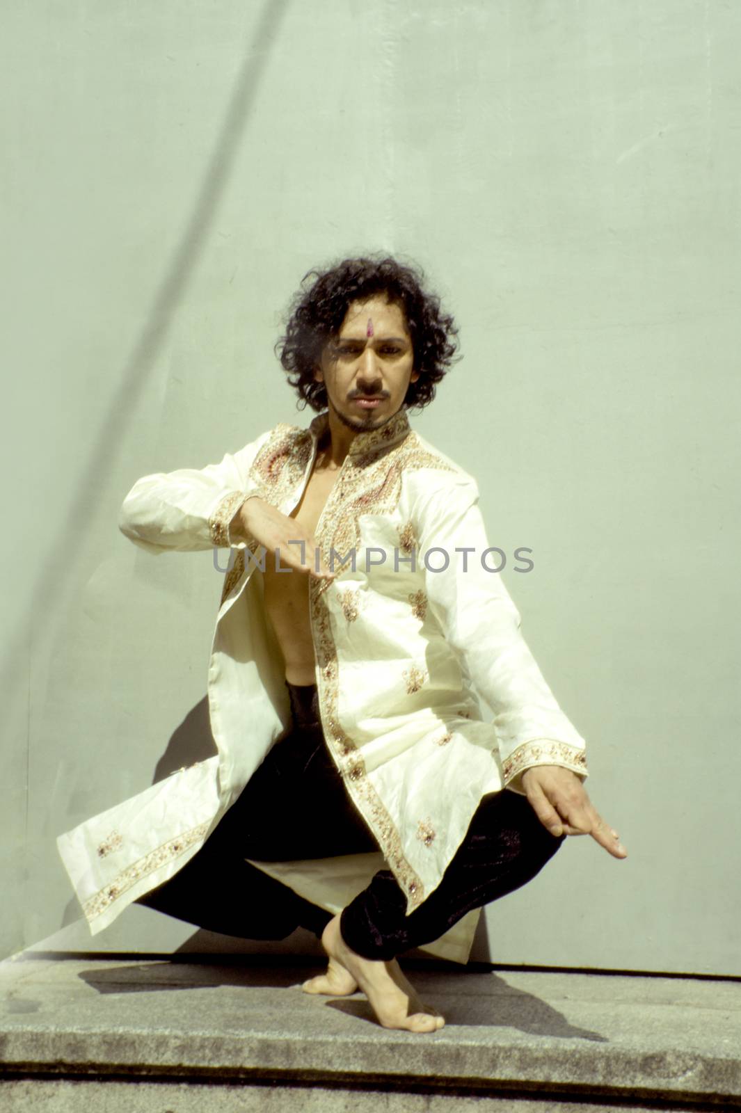 Bollywood dancer man over urban background