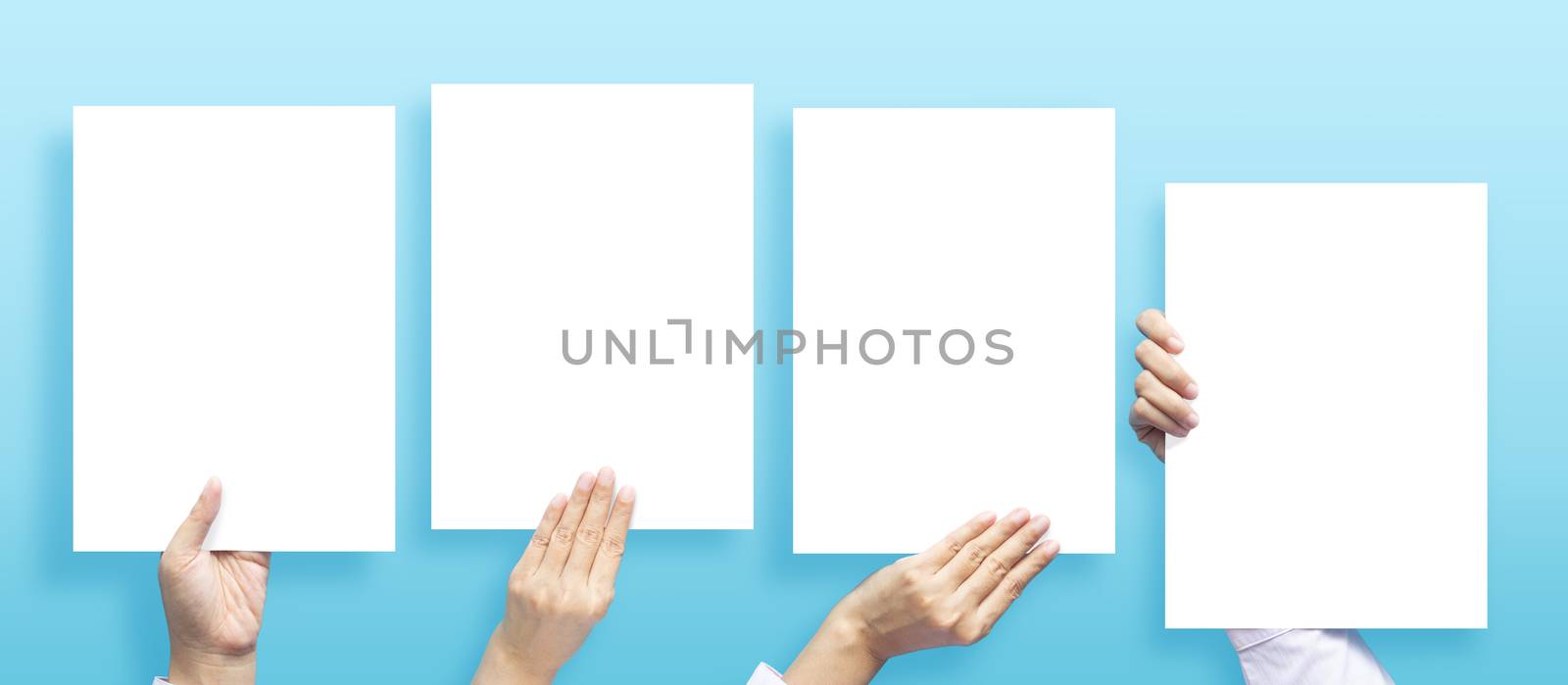 set of hands holding empty white blank letter paper size A4 for flyer or invitation mock up in different composition isolated on a blue background. by asiandelight