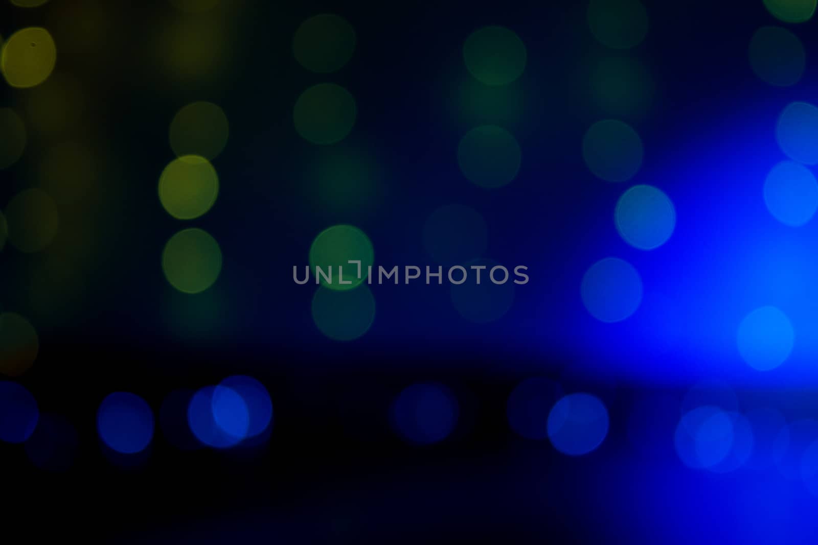 Blue and golden background with bokeh effect. Copy space