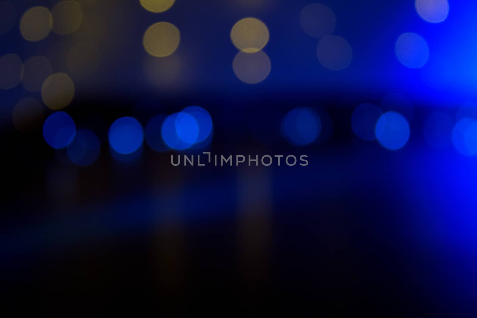 Blue and golden background with bokeh effect. Copy space