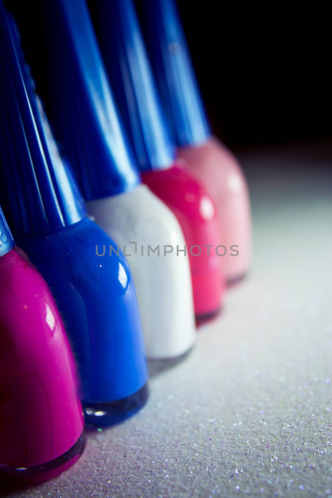 Nail polish placed in line. Copy space