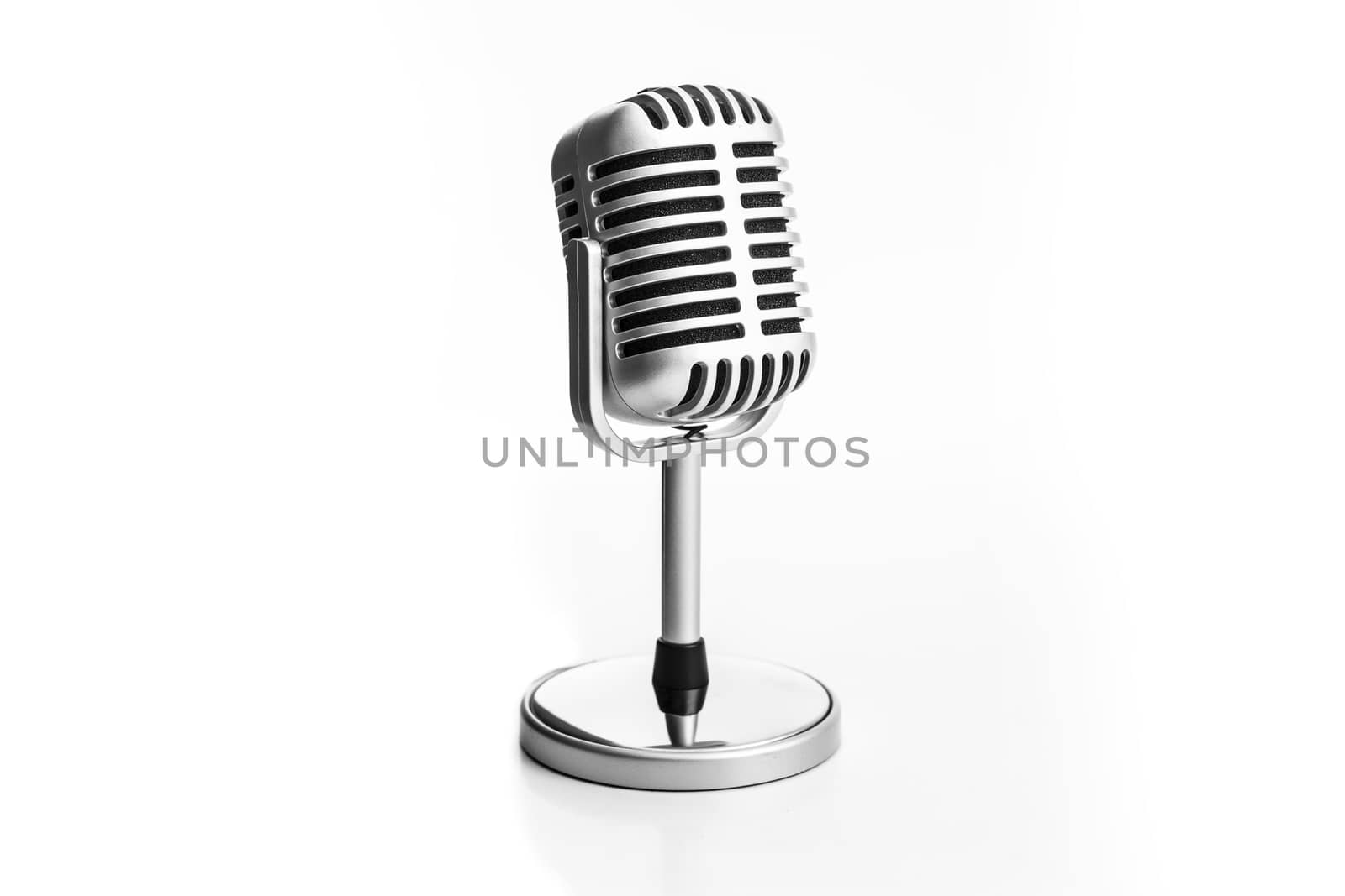 Retro microphone isolated on white background