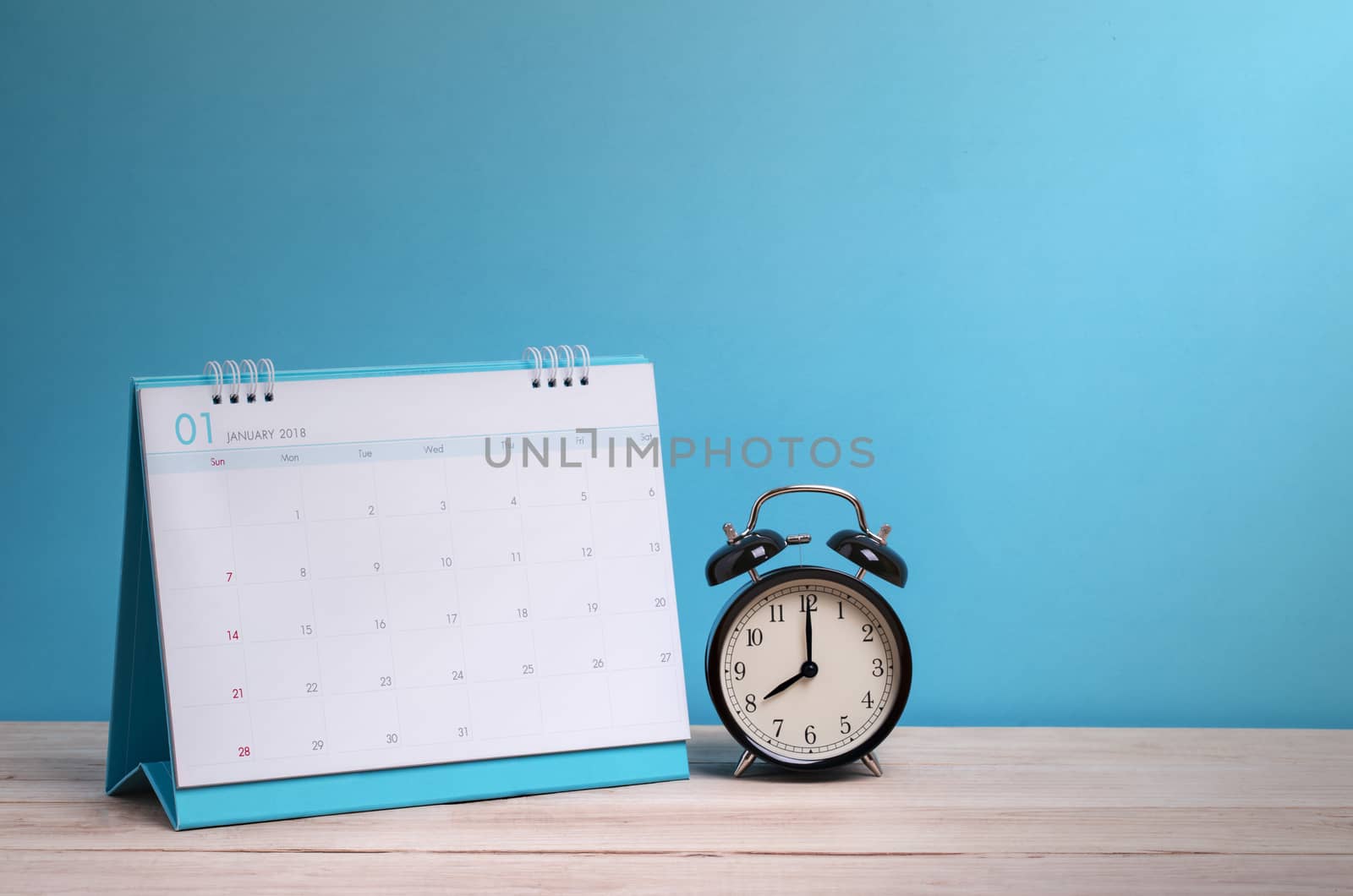 Vintage clock and calendar on wood, time concept