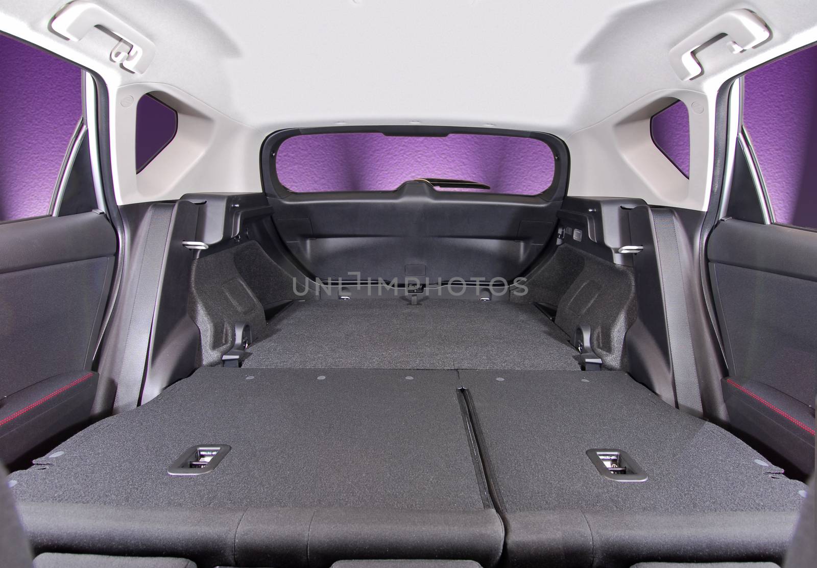 car trunk with rear seats folded, inside view