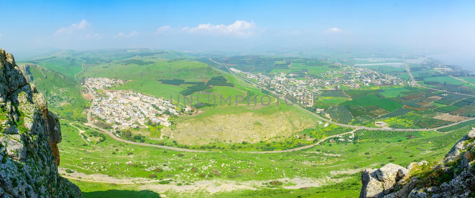 Panoramic landscape view form Mount Arbel, with Wadi Hamam village, Migdal and the Sea of Galilee. Northern Israel
