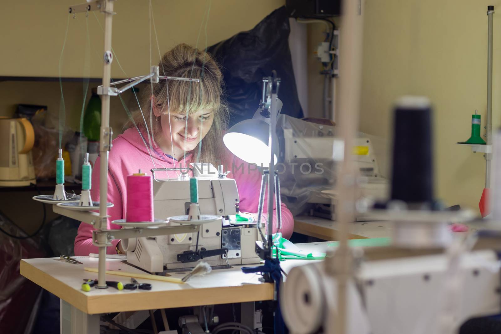 Garment worker works for an industrial sewing machine