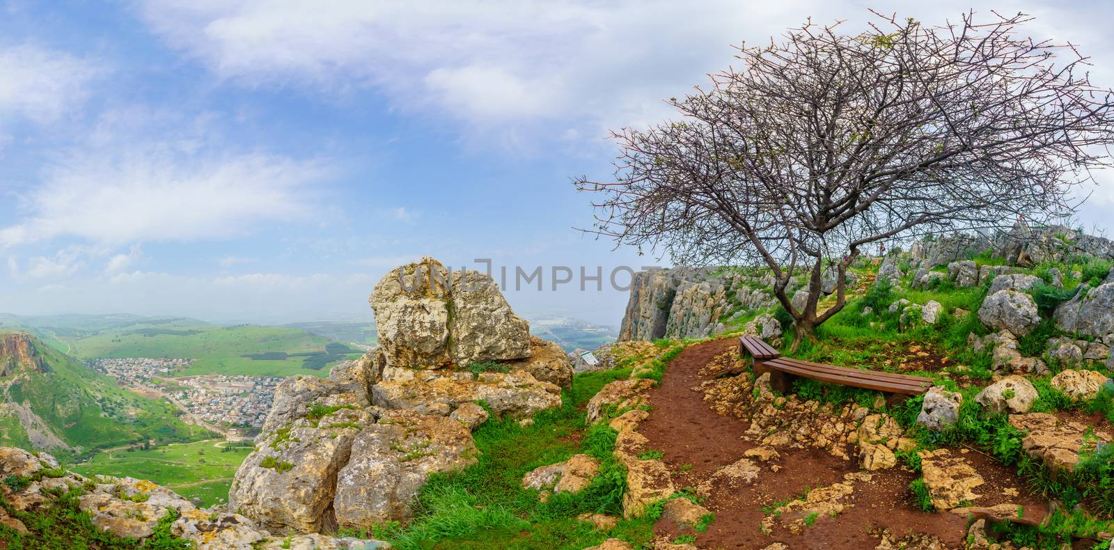 Panoramic landscape view form Mount Arbel, with Wadi Hamam village, Migdal and the Sea of Galilee. Northern Israel