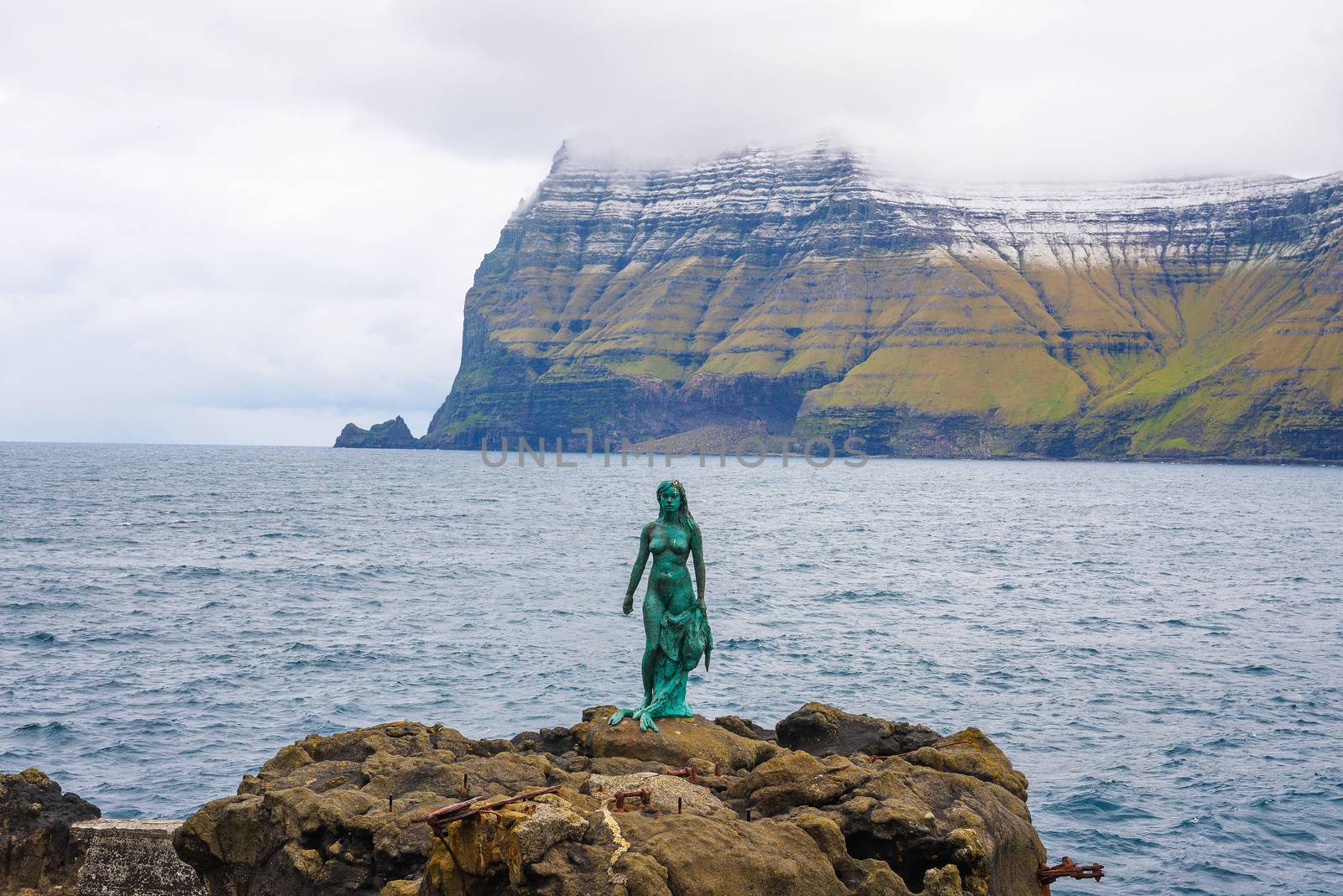 Statue of Selkie or Seal Wife in Mikladalur, Faroe Islands by nickfox