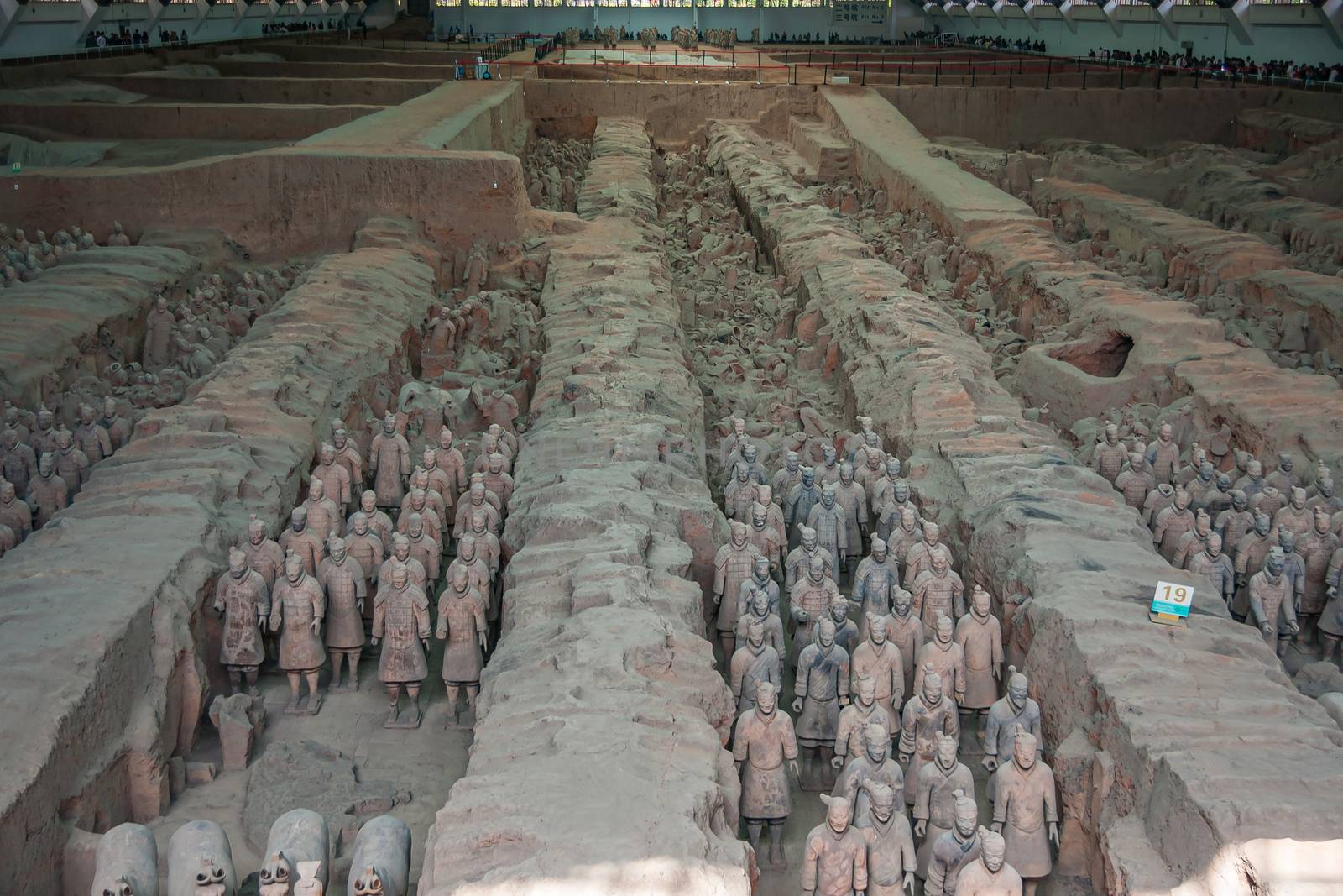 Xian, China - May 1, 2010: Terracotta Army museum and hall. Overview of the excavation site with plenty of statues.