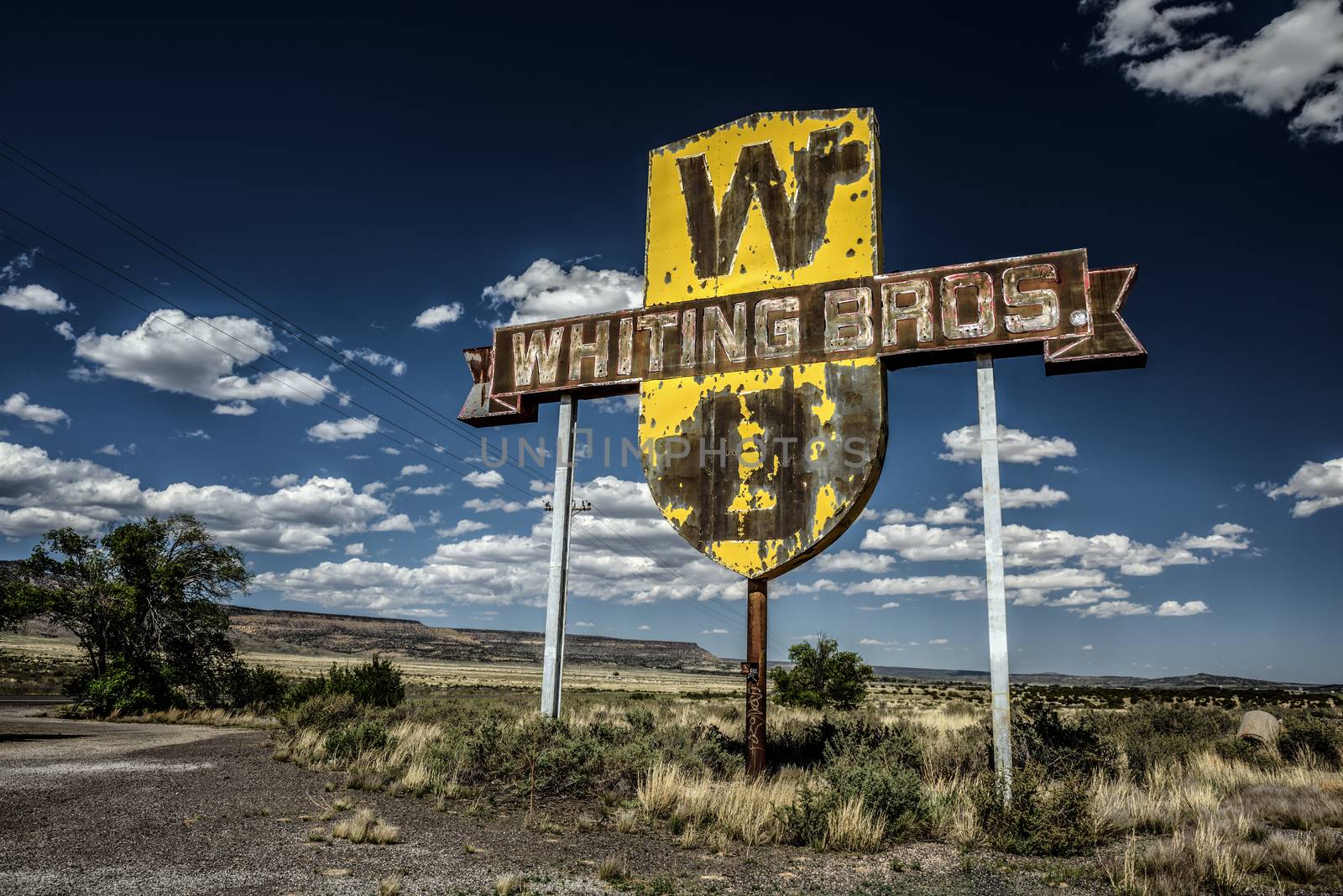 SAN FIDEL, NEW MEXICO, USA - MAY 13, 2016 : Vintage Whiting Bros. sign above a removed gas station on historic Route 66 in New Mexico.