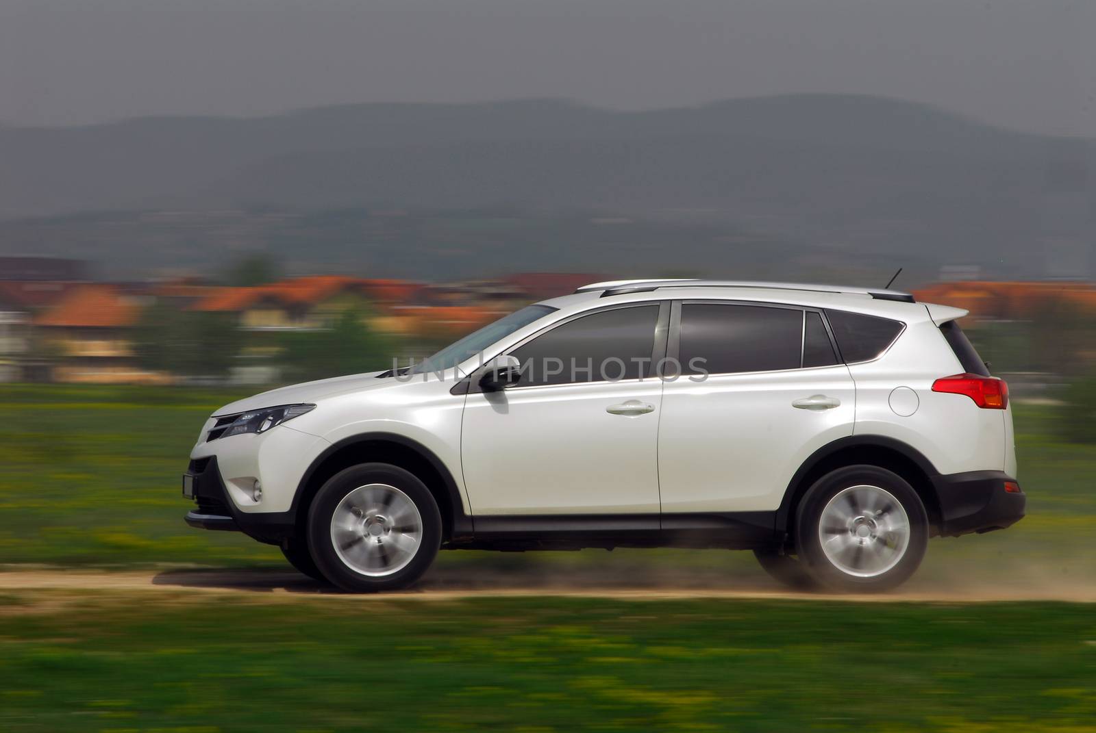 small Off-road car driving madly fast in the country