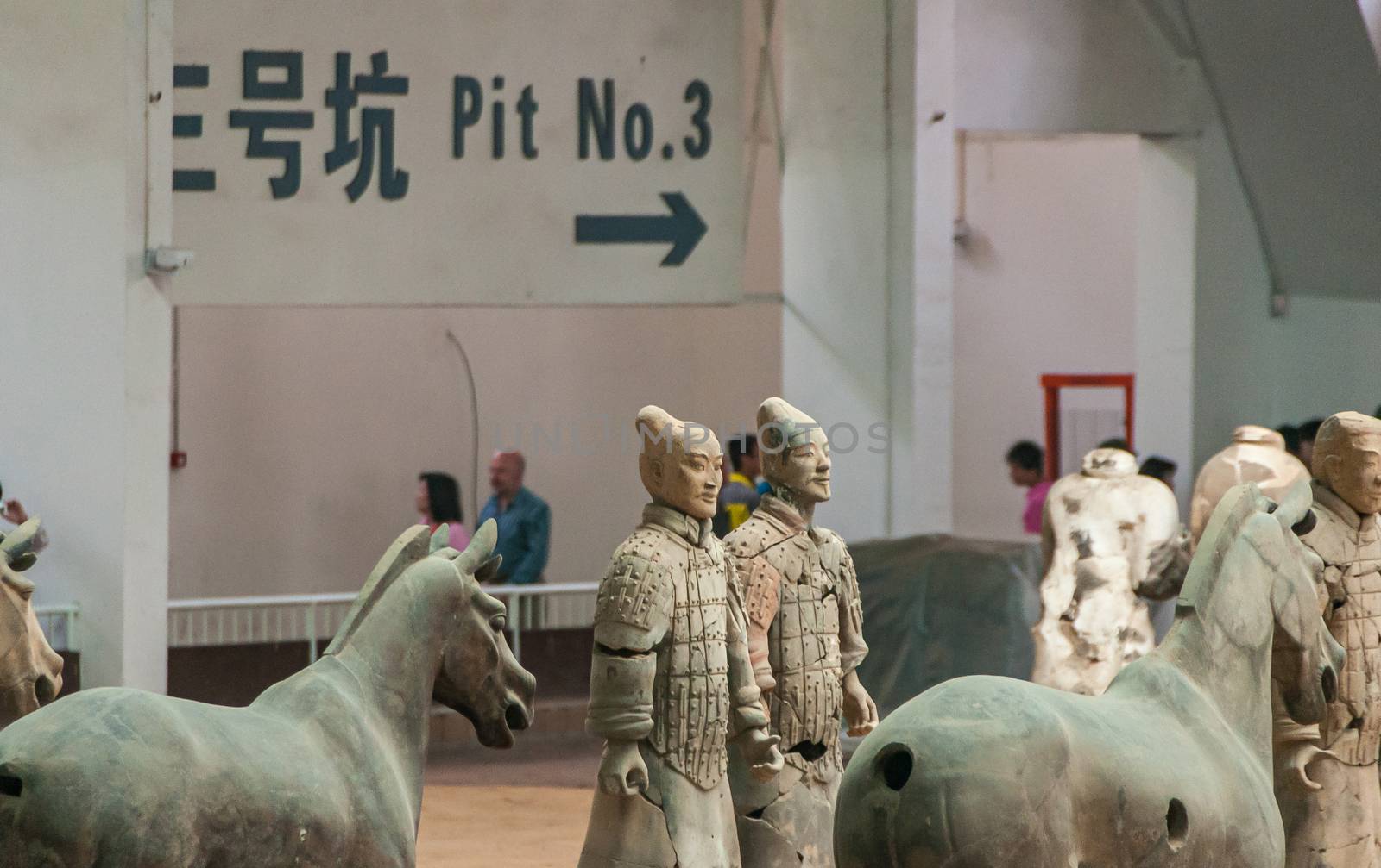 2 soldiers and 2 horses at excavation in Terracotta Army museum, by Claudine