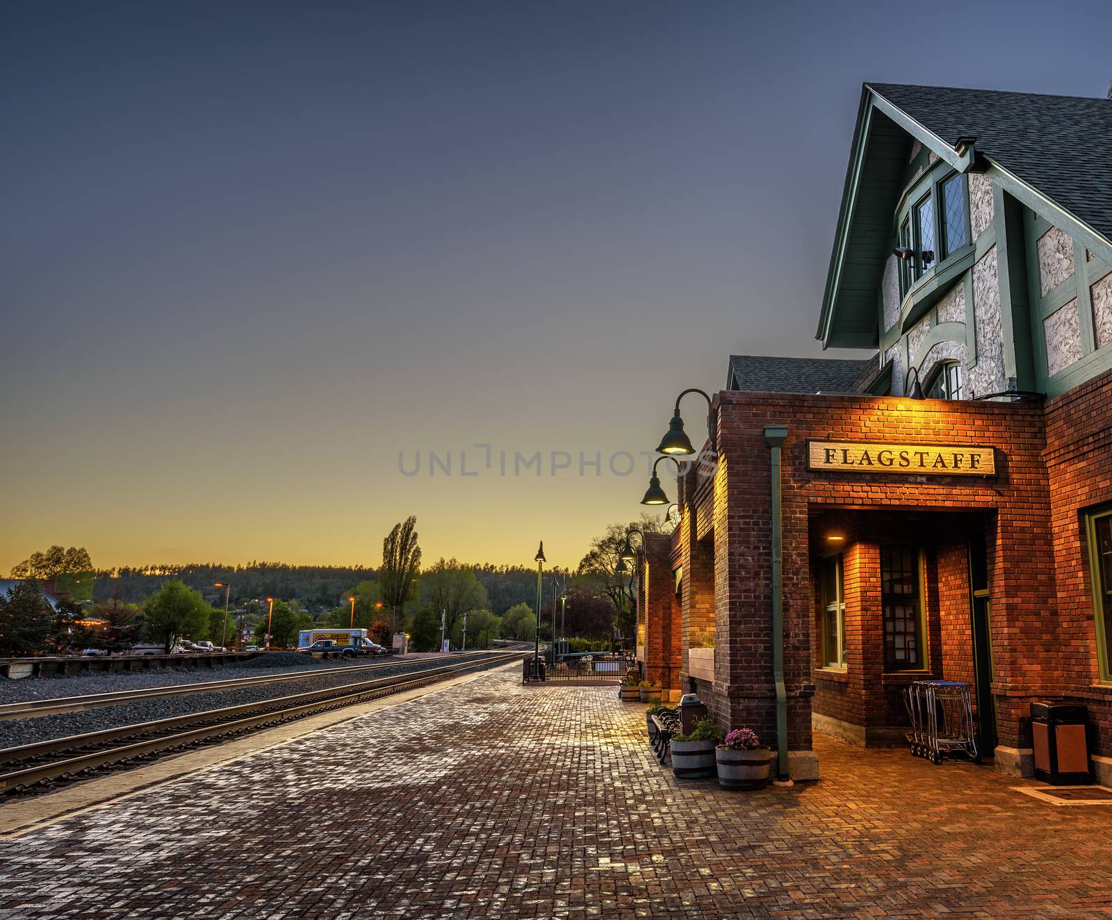 FLAGSTAFF, ARIZONA, USA - MAY 16, 2016 : Historic train station in Flagstaff at sunset. It is located on Route 66 and is formerly known as Atchison, Topeka and Santa Fe Railway depot. Hdr processed.