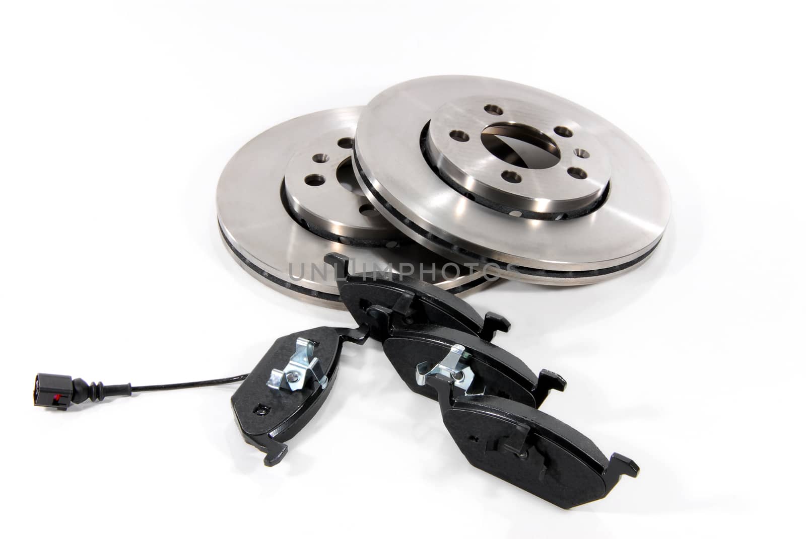 four brake pads and two new brake discs for the car