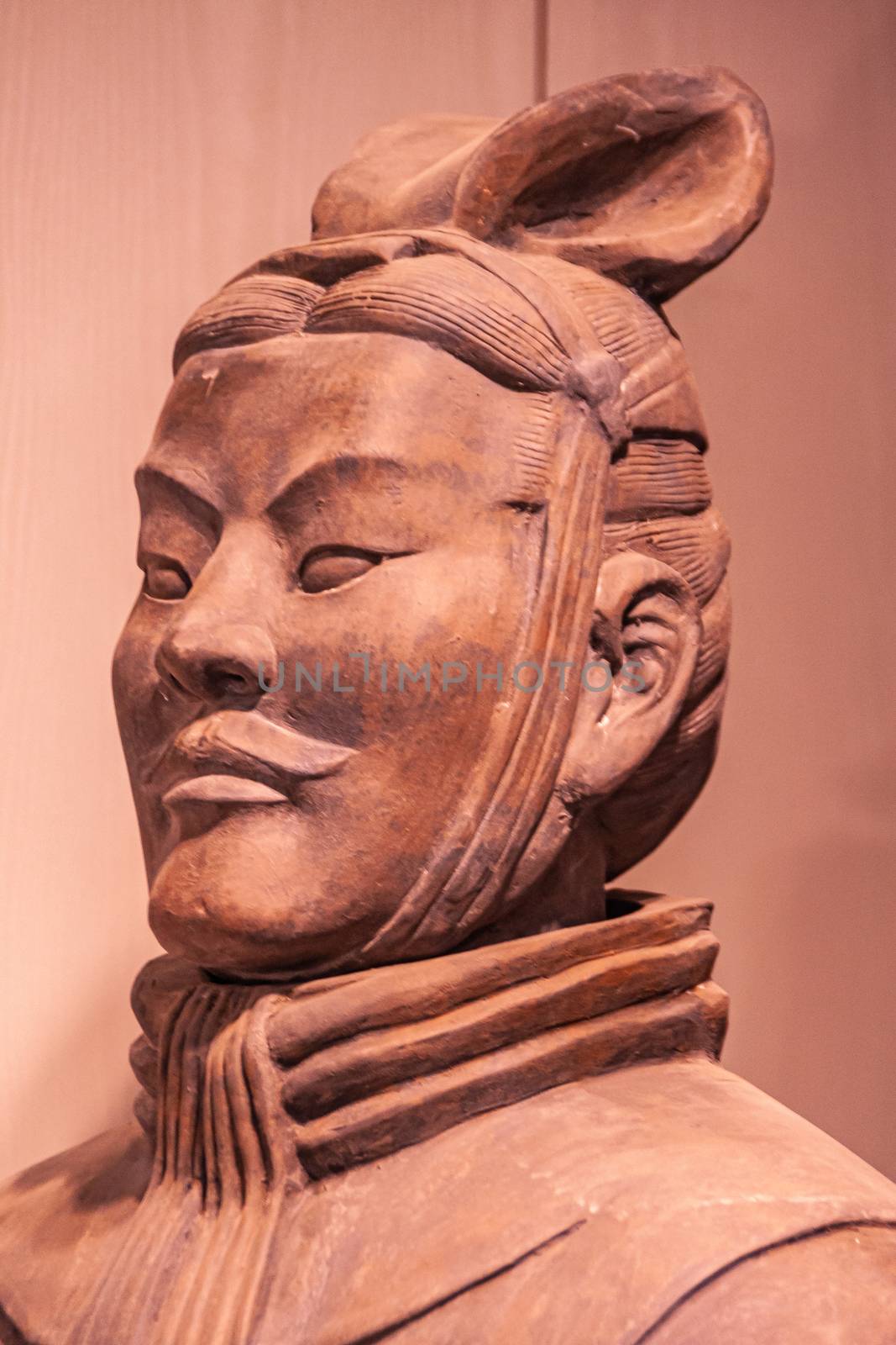 Xian, China - May 1, 2010: Terracotta Army museuml.  Side Closeup of reddish bearded head of officer sculpture.