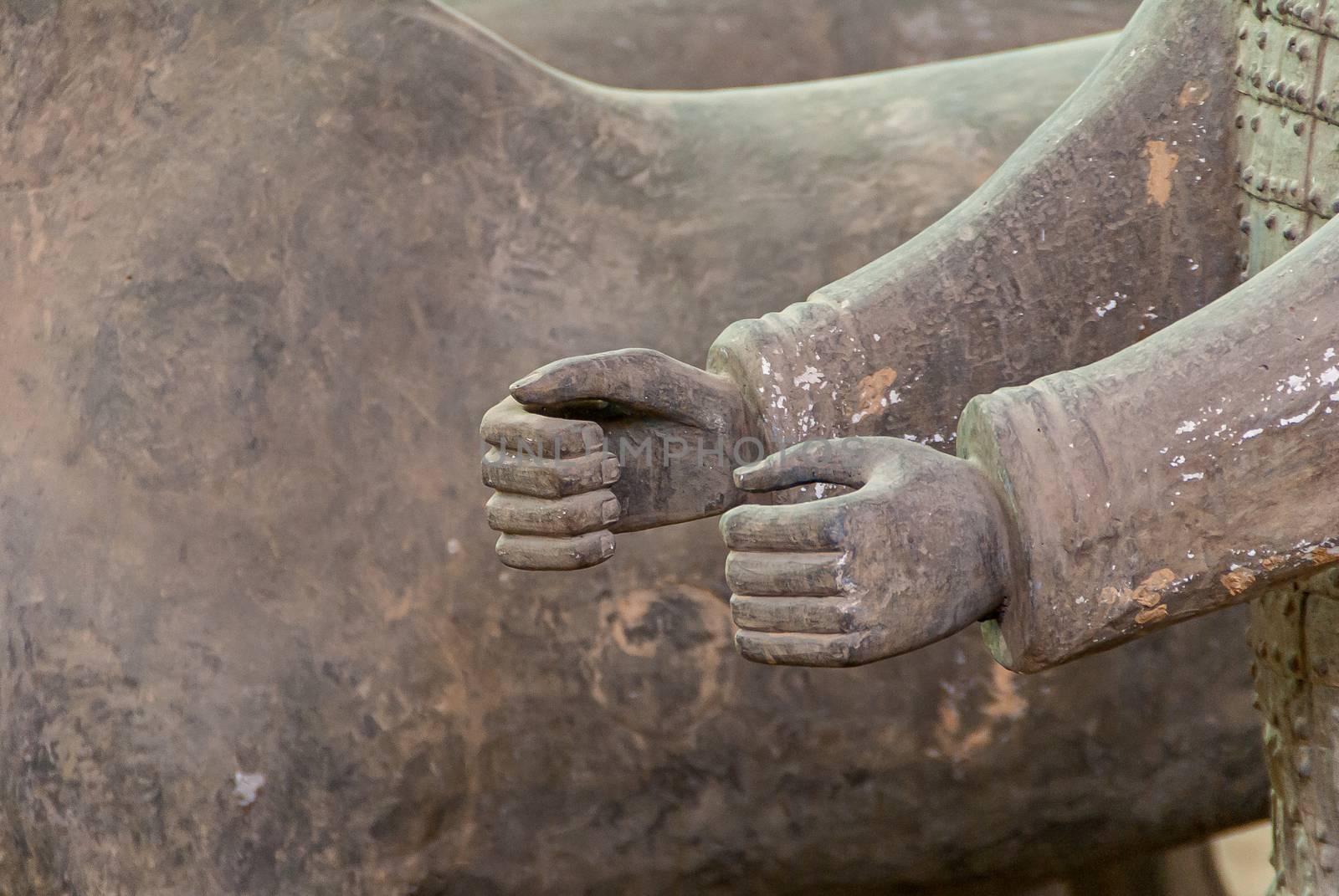 Closeup of 2 hands at Terracotta Army excavation hall, Xian, Chi by Claudine