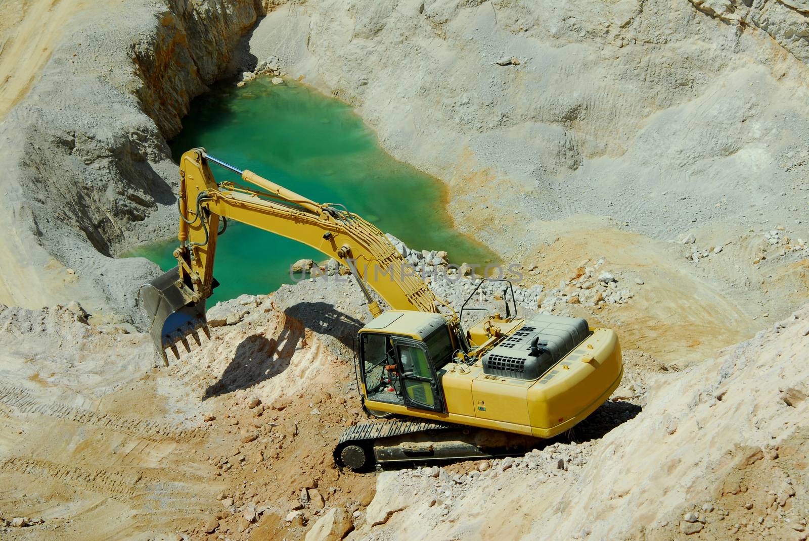 big yellow loader stands in the quarry