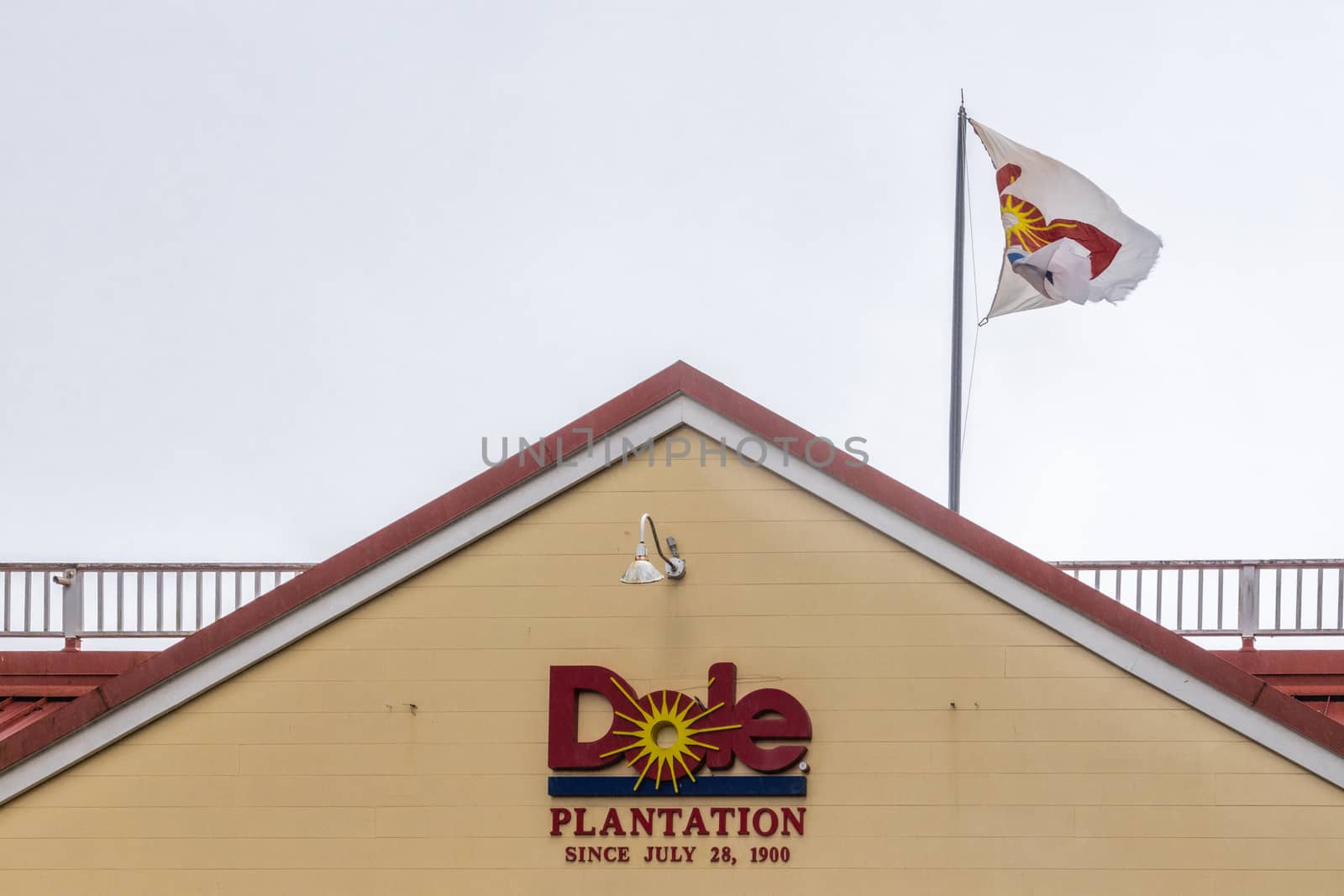 Logo and flag on building of Dole pineapple plantation in Wahiaw by Claudine