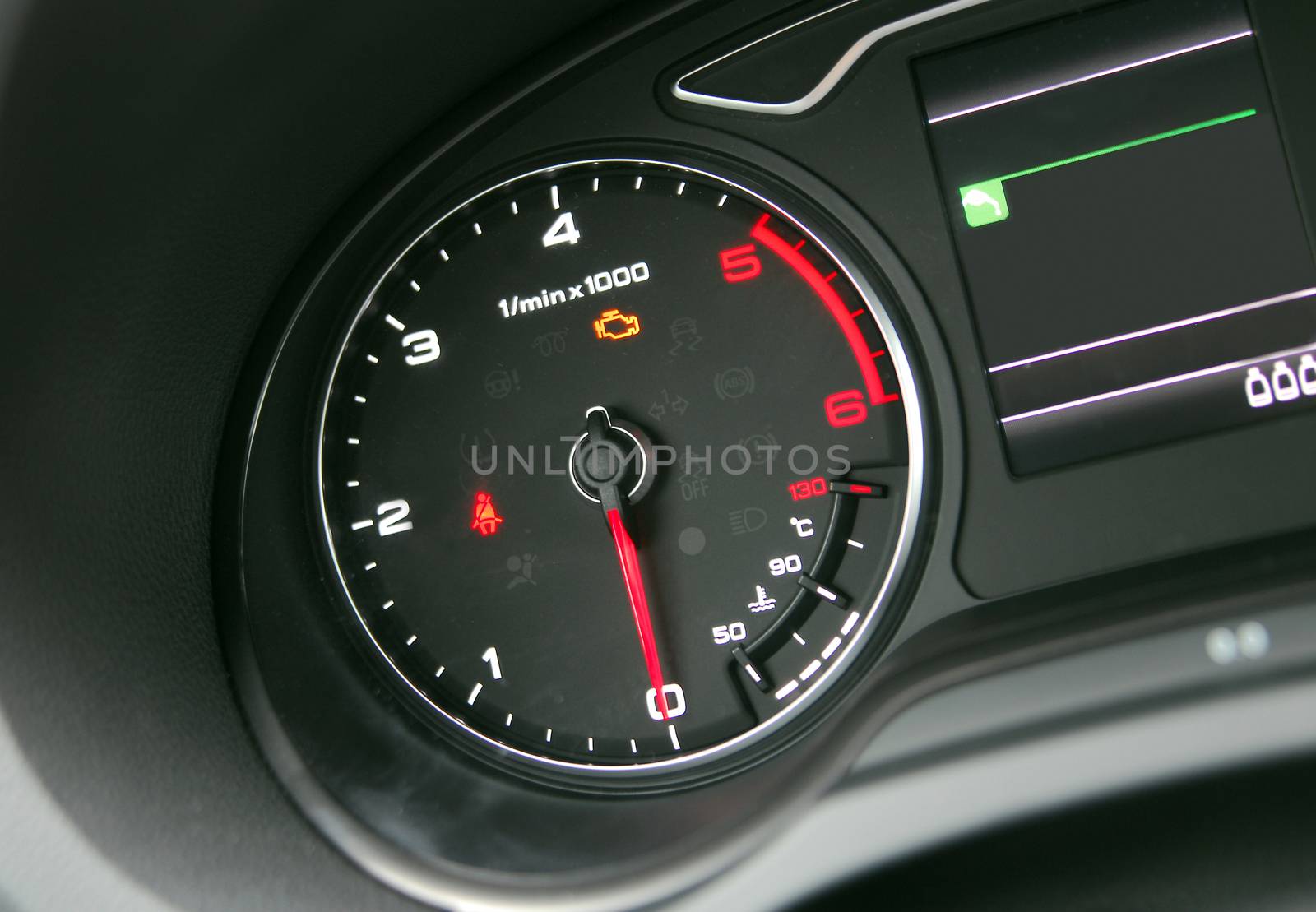 Car Tachometer photographed in a car that stands