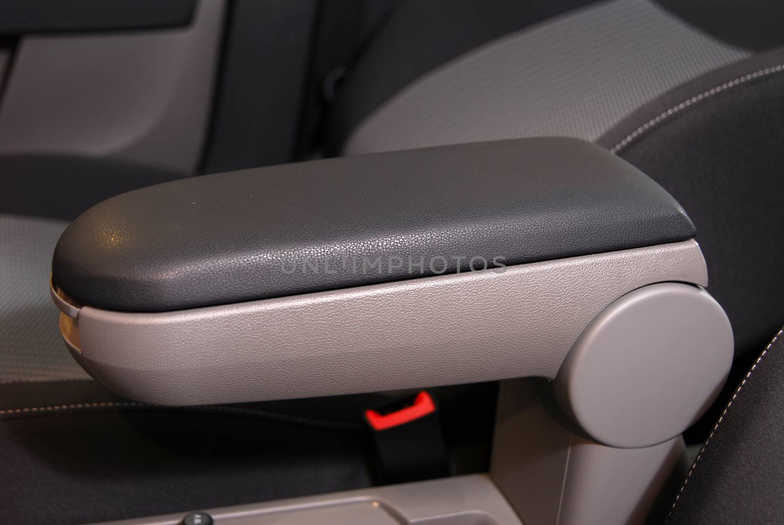 armrest in the luxury passenger car between the front seats by aselsa