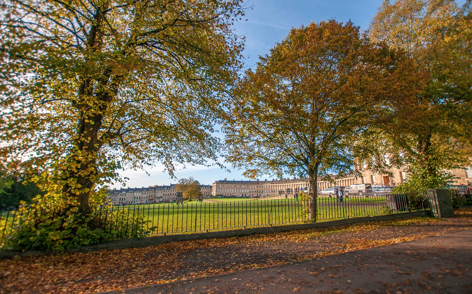 looking through trees at the royal crescent in bath by sirspread