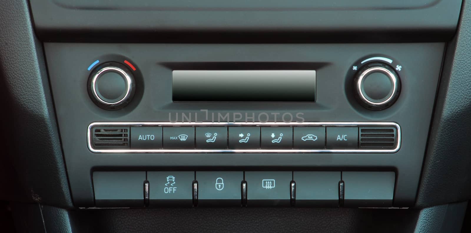 manual switches the air conditioning on the dashboard of the car