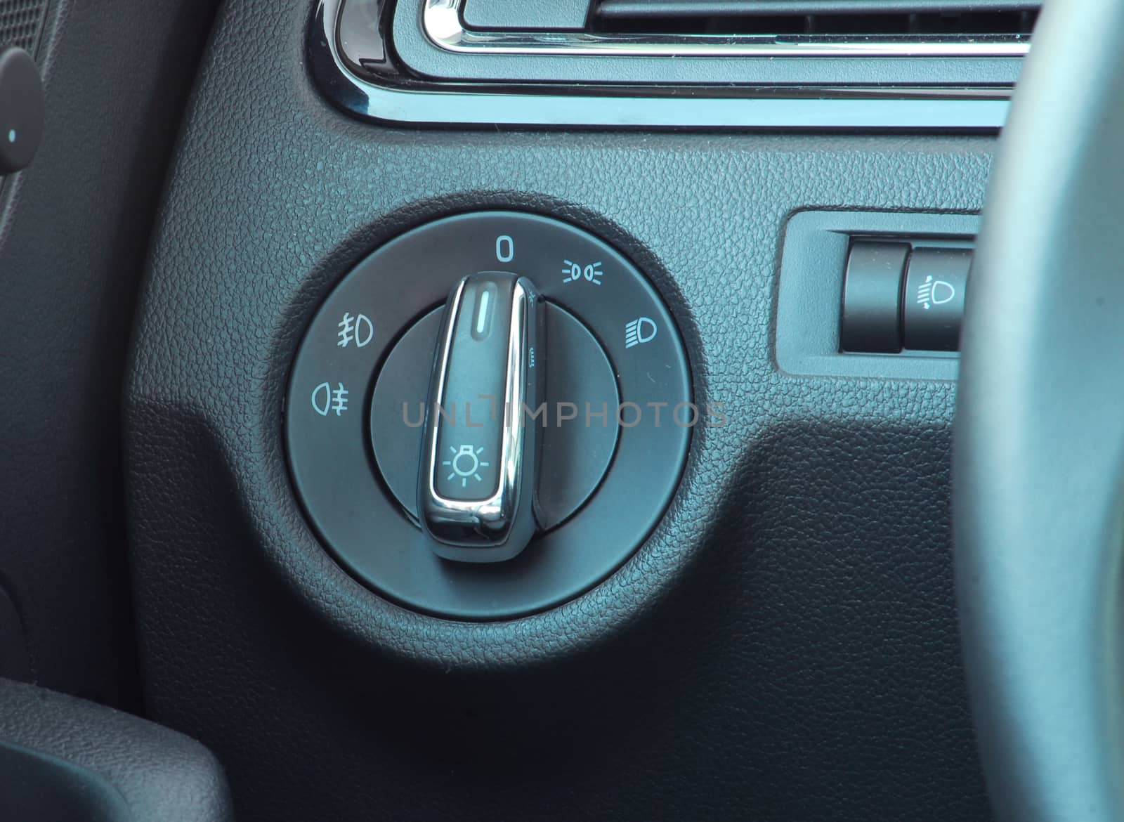 Closeup image of car lighting control switch