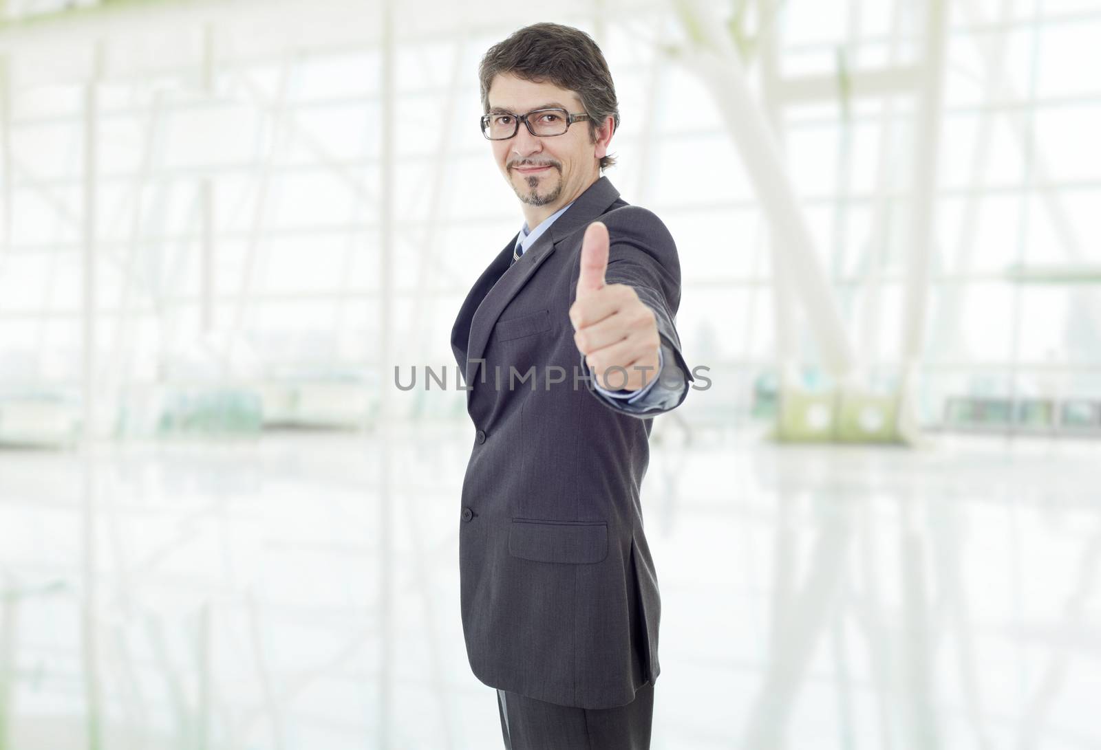 young business man going thumb up, at the office