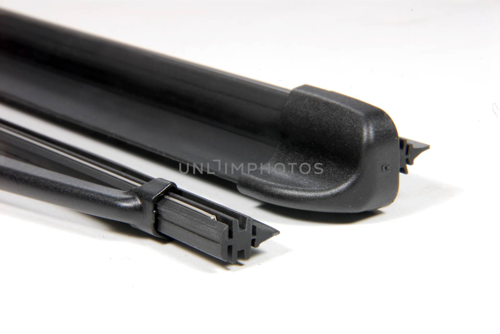 two cars windshield wipers on a white background