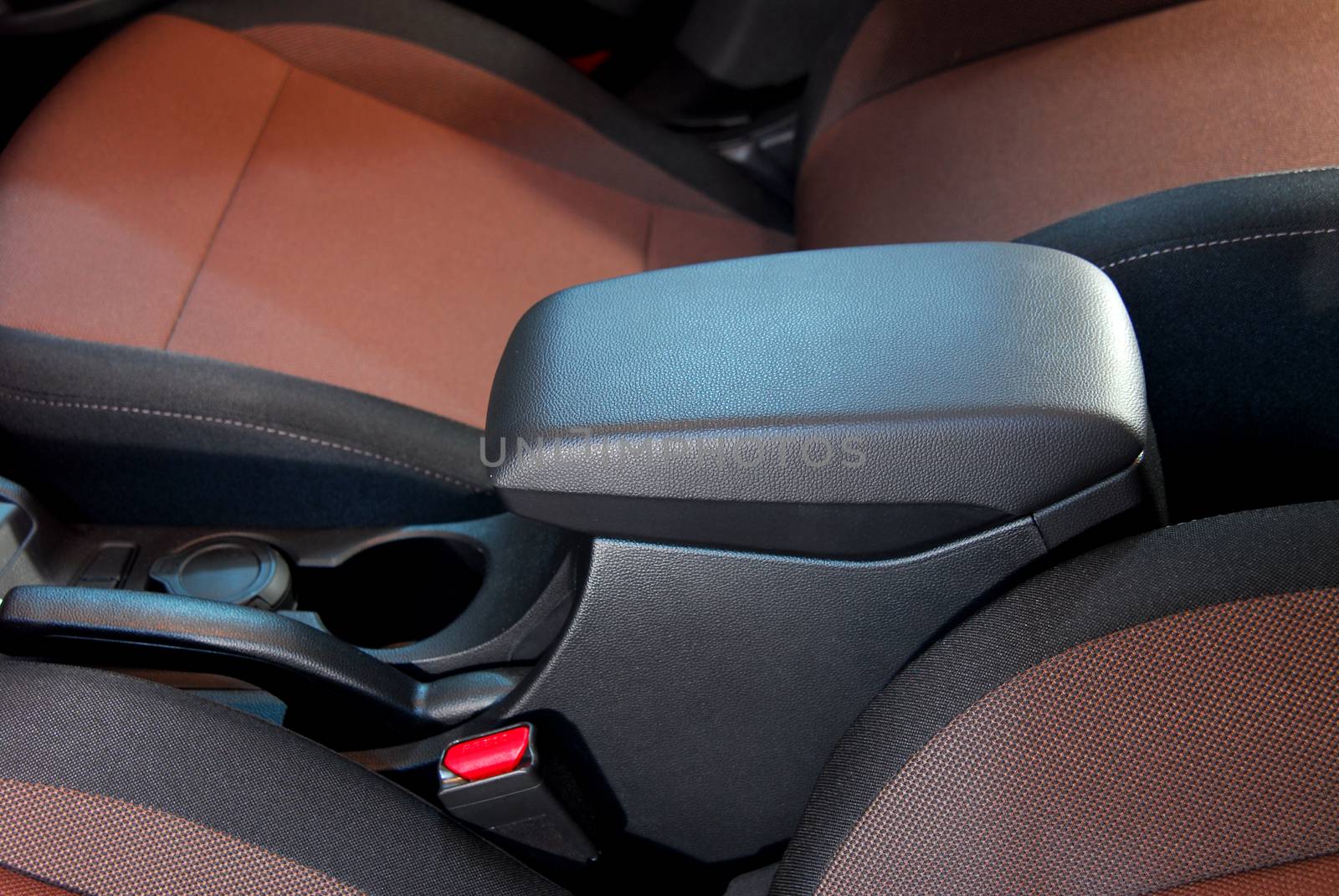 armrest in the luxury passenger car between the front seats by aselsa