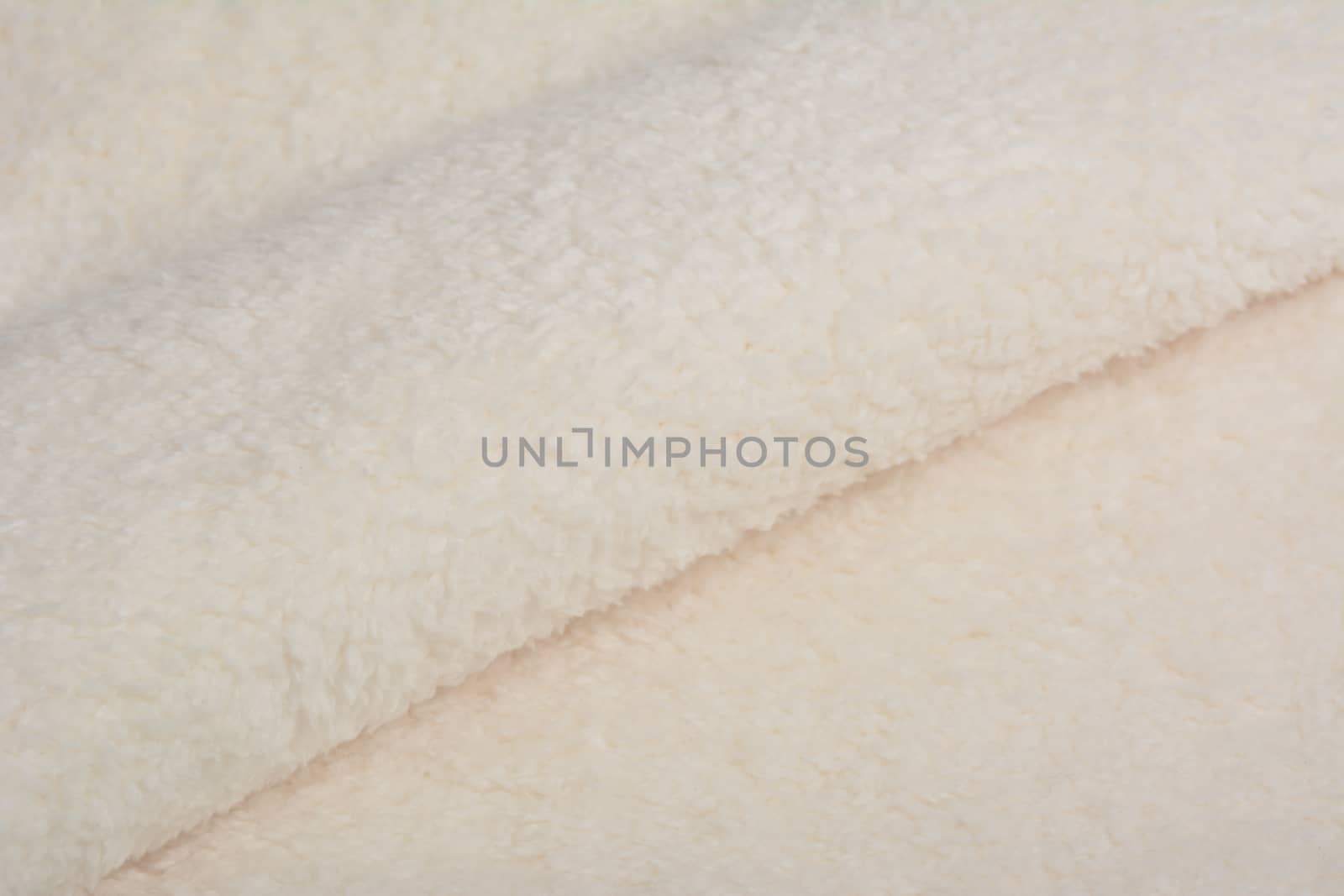 Abstract Artificial texture fur fabric, background, closeup. Fluffy material backdrop, kids toys faux fur.