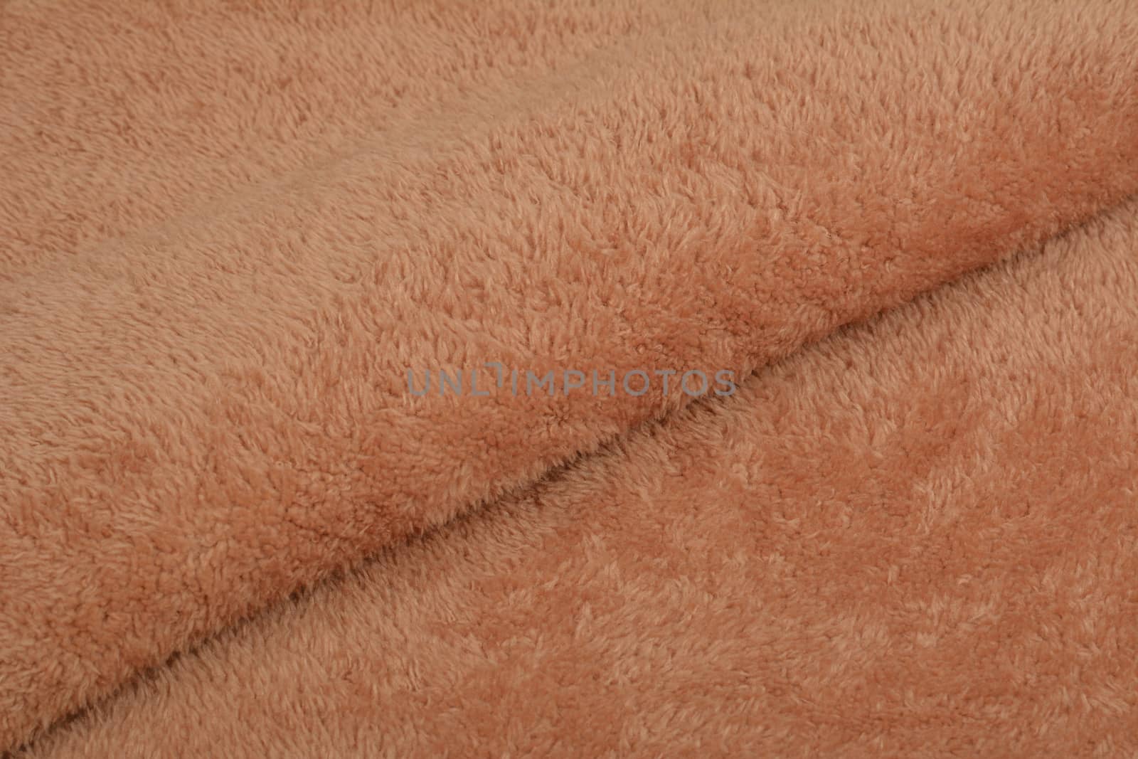 Abstract Artificial texture fur fabric, background, closeup. Fluffy material backdrop, kids toys faux fur.