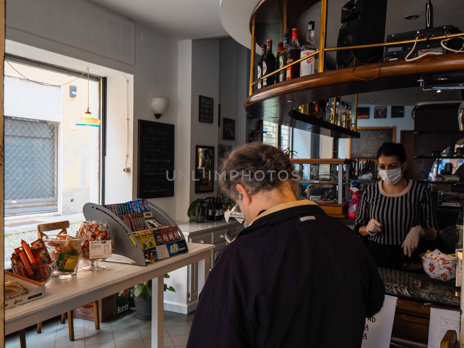 Cremona, Lombardy Italy,  may 2020 -  Bartender woman  at cafe b by verbano