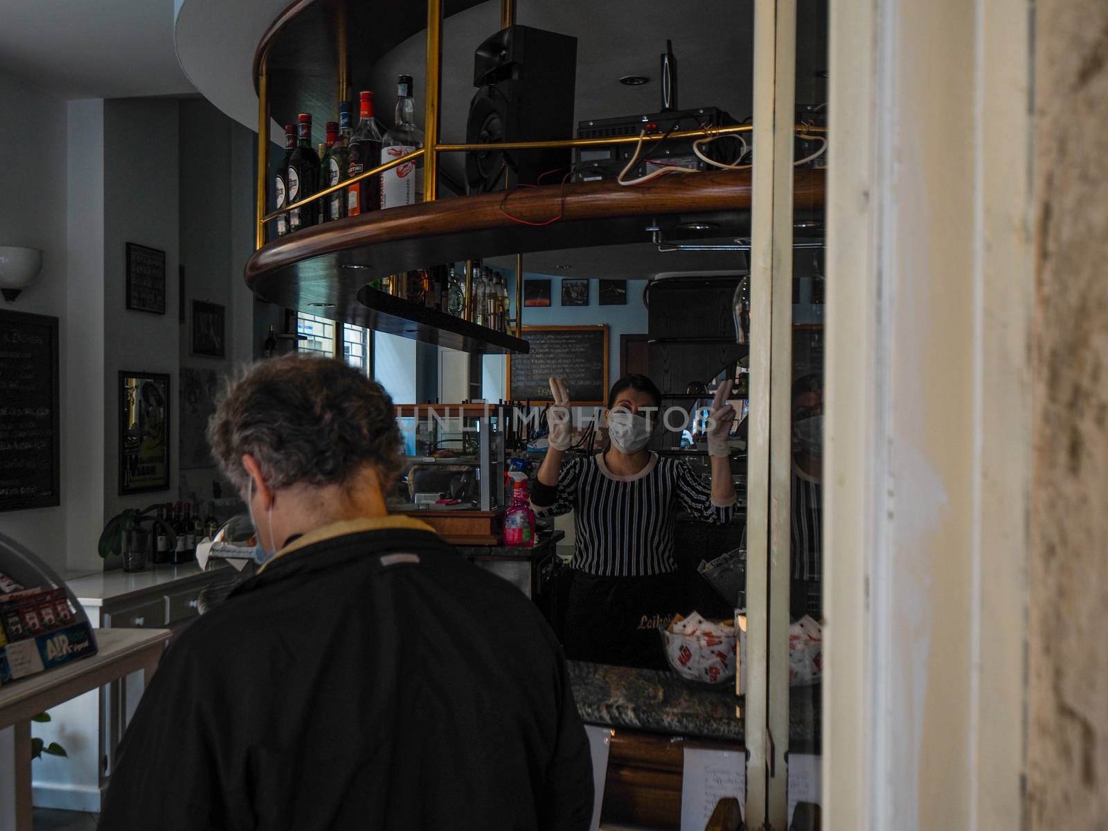 Cremona, Lombardy Italy,  may 2020 -  Bartender woman  at cafe b by verbano