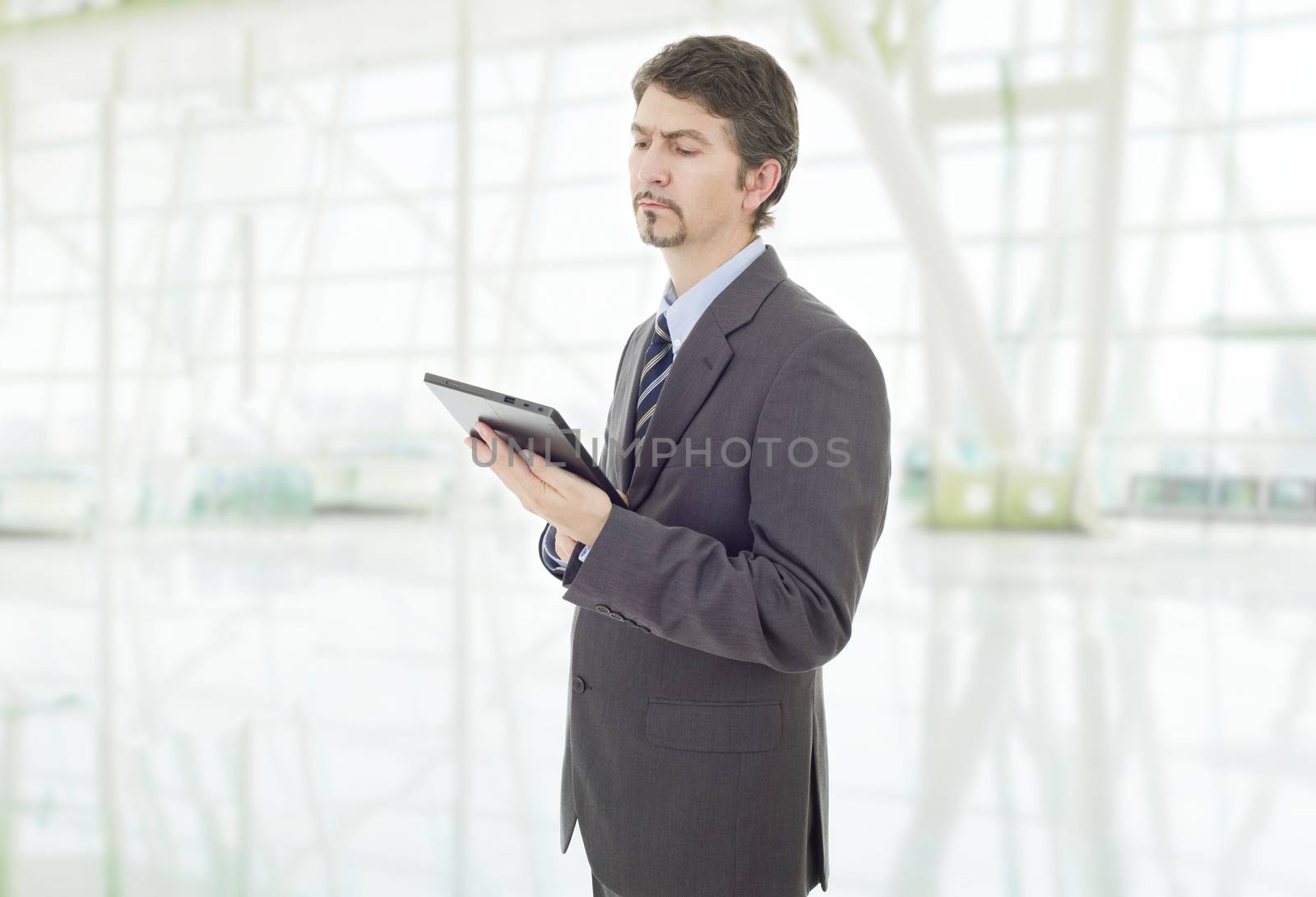 young businessman with a tablet pc, at the office