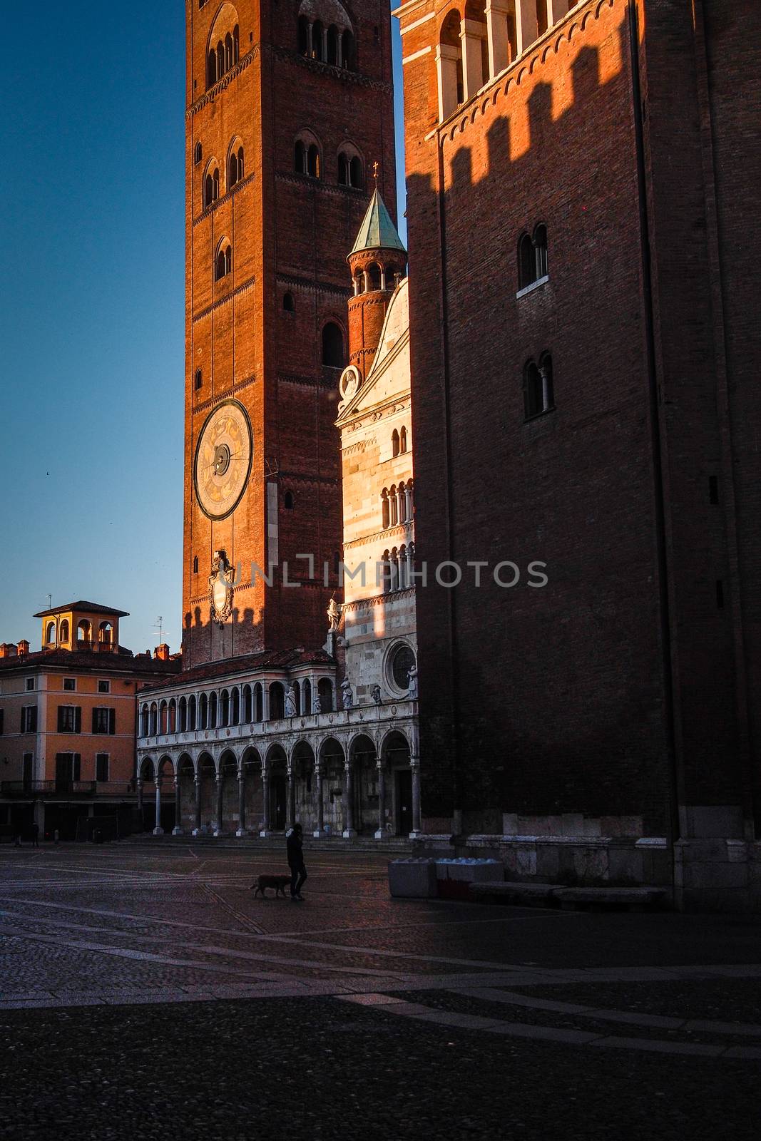 Cremona, Lombardy, Italy - April 30 th - May 1st 2020 - people biking walking dog walking in the center during covid 19  lockdown and economic crisis in Lombardy affected region.