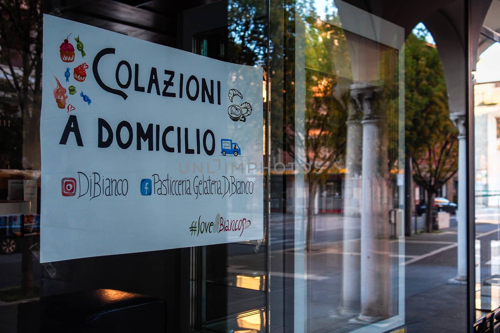 Cremona, Lombardy, Italy - April 30 th - May 1st 2020 - closed bars  and general commerce  during coronavirus lockdown and economic crisis. Italian signs