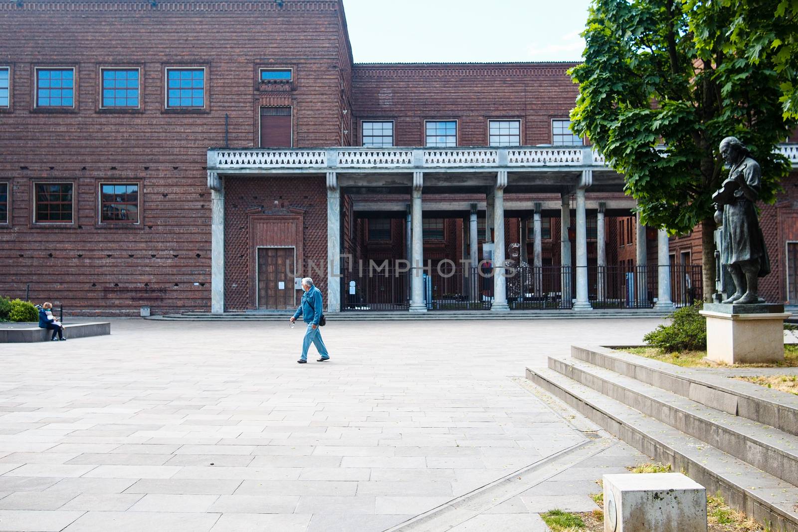 Cremona, Lombardy, Italy - April 30 th - May 1st 2020 - people biking walking dog walking in the center during covid 19  lockdown and economic crisis in Lombardy affected region.