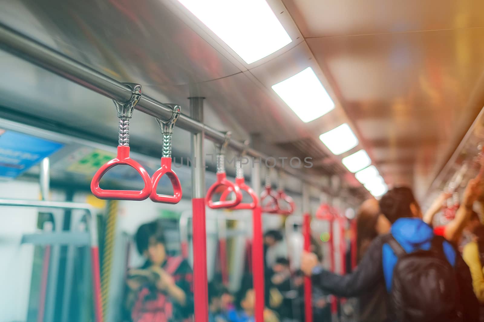 Handles for standing passenger in subway by Surasak