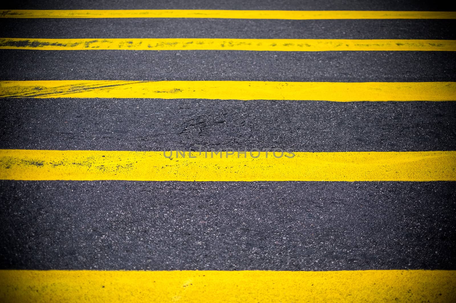Road Marking Yellow Lines on asphalt by Surasak